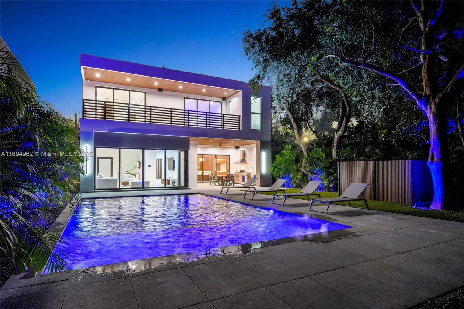 Discover this newly built, 5-bedroom, 5.5-bath luxury home in Miami's Design District. Spanning 4,784 sq. ft. (3,591 sq. ft. under air), this custom masterpiece blends modern design with premium craftsmanship. A grand 25-ft foyer opens to a spacious layout featuring 11-ft ceilings, LED accents, and a Sonos system. The chef’s kitchen includes imported Fulgor appliances, custom cabinetry, a wine cooler, and a walk-in pantry. The private backyard oasis boasts a pool, Pentair Intellicenter, and an Italian porcelain deck. The master suite offers a balcony, a spa-inspired bath, and a walk-in closet. Additional en-suite bedrooms, smart lighting, and advanced security enhance this extraordinary home. Schedule your tour today!
