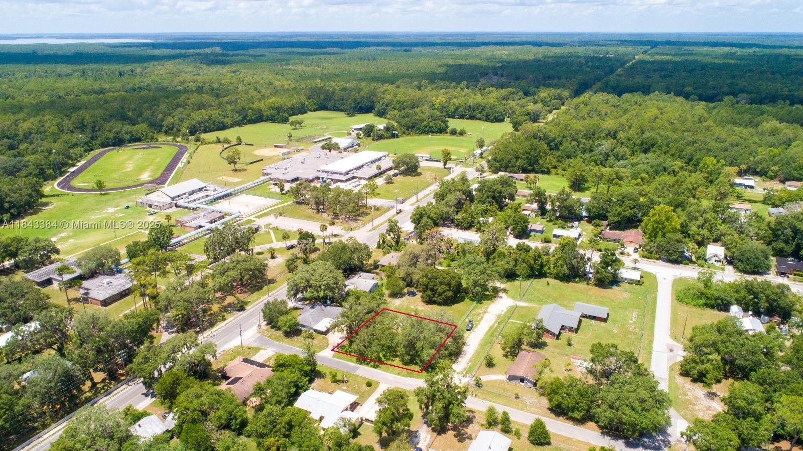 0.25 acres Land for Sale–SE 68th Ln, Hawthorne, FL. Zoning: Residential. Build-Ready Lot, High & dry land suitable for a site-built or manufactured home. No wetlands. 289.18 ft paved road frontage, easy driveway access & flexibility. Power available at the street. Water via well & sewer via septic–both commonly used in the area. Quiet neighborhood with a mix of established homes & new development. Close to Lake Lochloosa, Lake Sampson & Orange Lake. No HOA restrictions. Low Property Taxes: Affordable holding cost, great for long-term investment or seasonal use. Just off State Road 20—close to Gainesville & Ocala. Hawthorne is seeing steady growth with new developments & infrastructure improvements, great investment area. ALL INFORMATION FROM THE SELLER AND MUST BE VERIFIED BY THE BUYER!