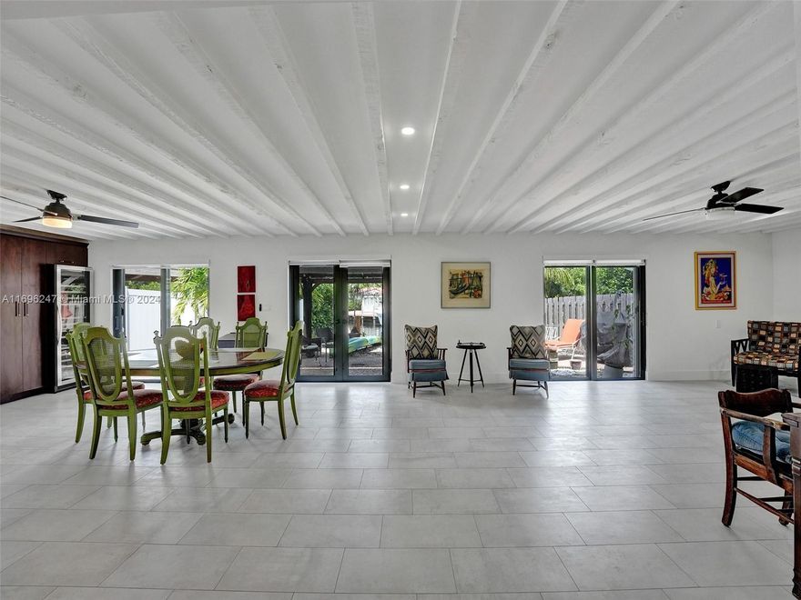 Discover an exceptional slice of Florida living in this one-of-a-kind masterpiece nestled in the heart of Fort Lauderdale. This 2-bedroom, 1-bathroom residence redefines spaciousness and style, boasting an impressive 2000 square feet of meticulously designed space. With unrestricted ocean access, complete with a 20-foot dock, this property caters to water enthusiasts, accommodating smaller boats, kayaks, paddleboards, or jet skis. Enjoy a Chef's dream kitchen adorned with sleek black gloss appliances, Carrara Quartz Counters, plenty of cabinet space followed by buffets and a wine cellar+Impact windows and doors, Home Reverse Osmosis water filter system and natural Gas-The floors are terrazo and tile and the living area ceilings have exposed trusses! Too many details to list!