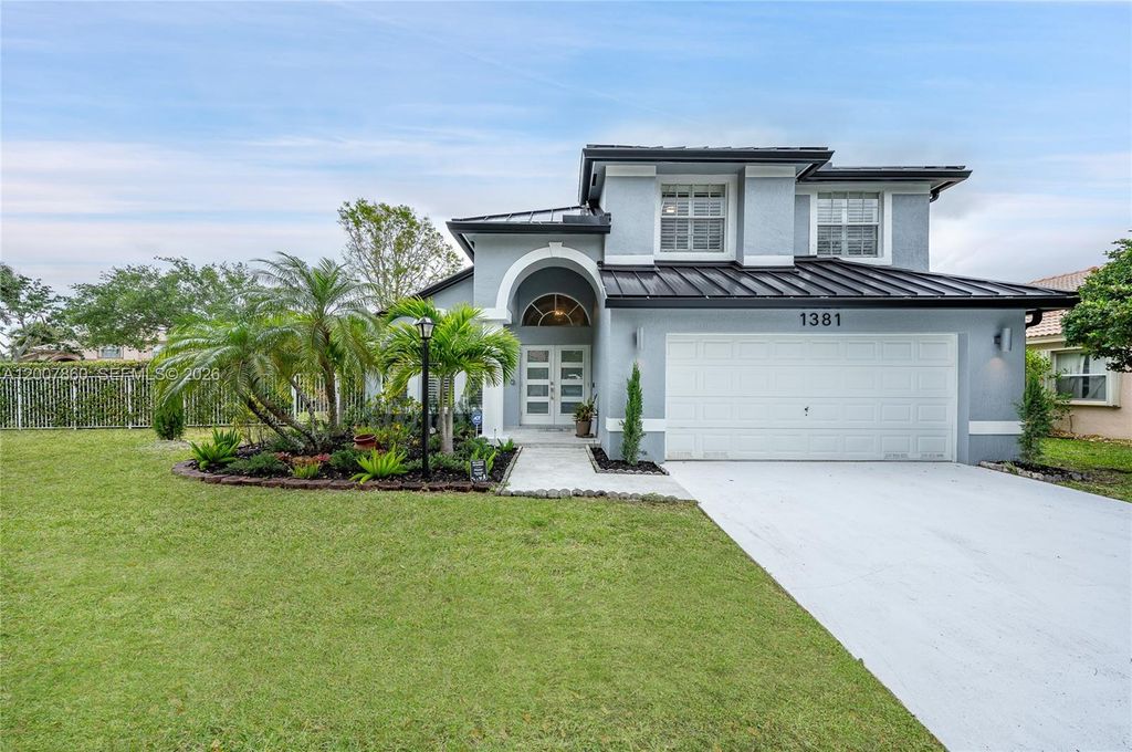 Photo of 1381 NW 144th Ave, Pembroke Pines, FL 33028 (MLS # A12007860)