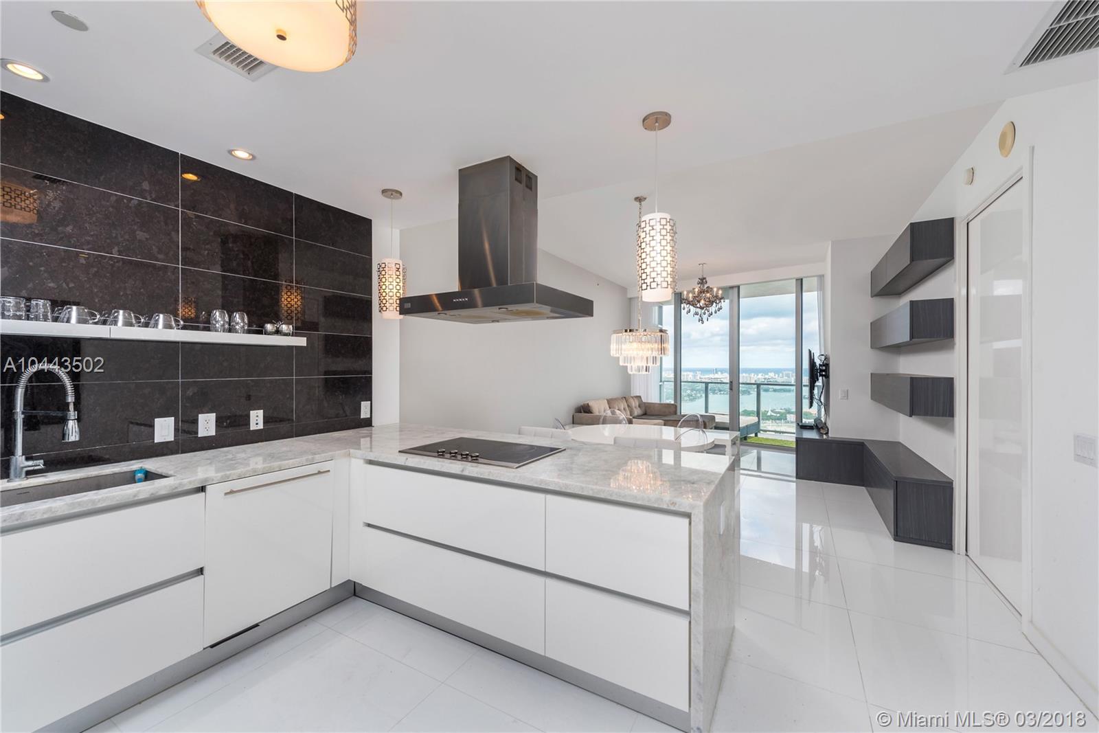 AVAILABLE APRIL 25th. Stunning 2 Bed/2.5 Bath condo at the luxurious Marquis Residences. Property features include: white porcelain flooring throughout, renovated Kitchen & Bathrooms, 4 chandeliers, custom lighting, built-in cabinets, motorized shades, Nest thermostat and more. Breathtaking views of Ocean, Bay, cruise ships & Miami Beach skyline from 52nd floor. Rent includes: 1 assigned parking space, basic cable TV, high-speed Internet & water. Amenities: fitness center, pool, hot tub, steam room & concierge.