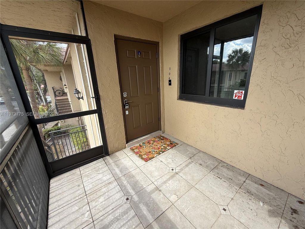 Photo of 302 Lakeview Dr #204, Weston, FL 33326 (MLS # A11973775)