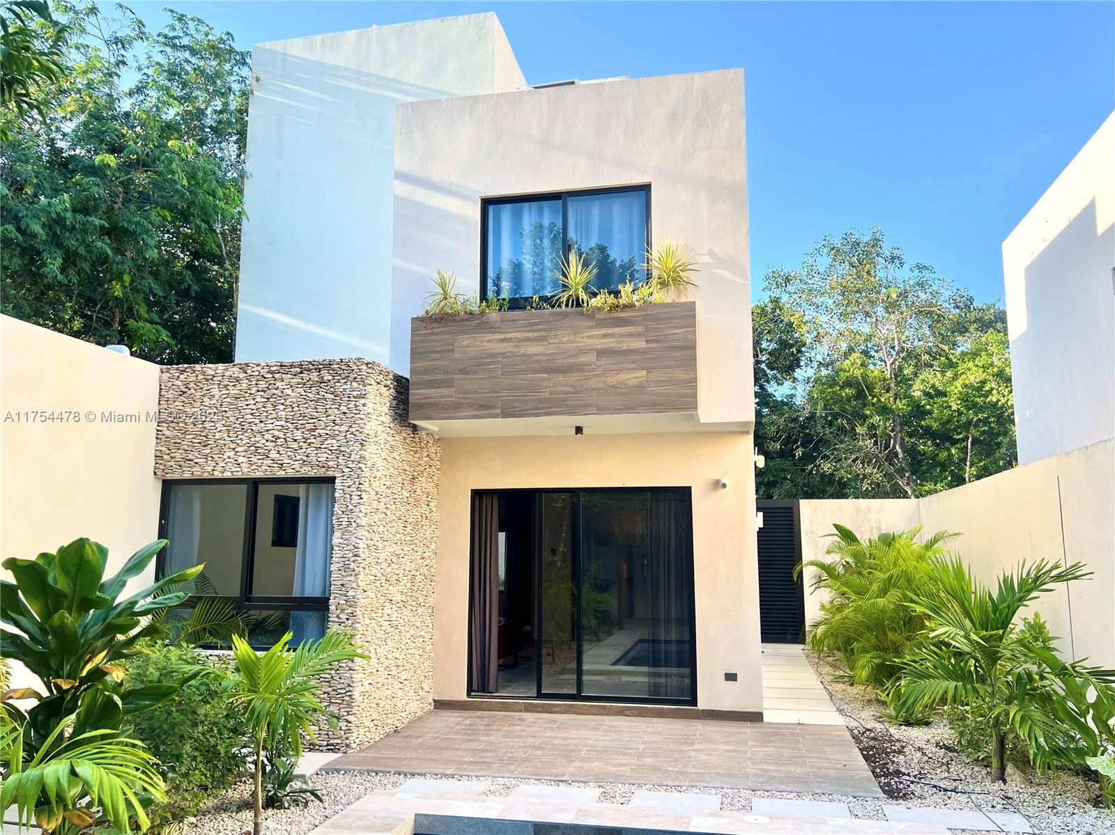 Nicte Villa at Villas Kaybé in Tulum is a luxurious three-bedroom, three-level home designed for both living and high Airbnb potential. With 475 m² of construction on a 324.31 m² lot, it features a private pool, rooftop with grill, garden, and elegant finishes like travertine marble and Tzalam wood. Three full and two half bathrooms make it ideal for hosting guests. Located in a gated community with top-tier amenities, including pools, a gym, spa, and padel court, it offers privacy and resort-style living. With immediate delivery, Nicte Villa is a prime investment for rental income or a tranquil home in Tulum’s lush jungle setting.