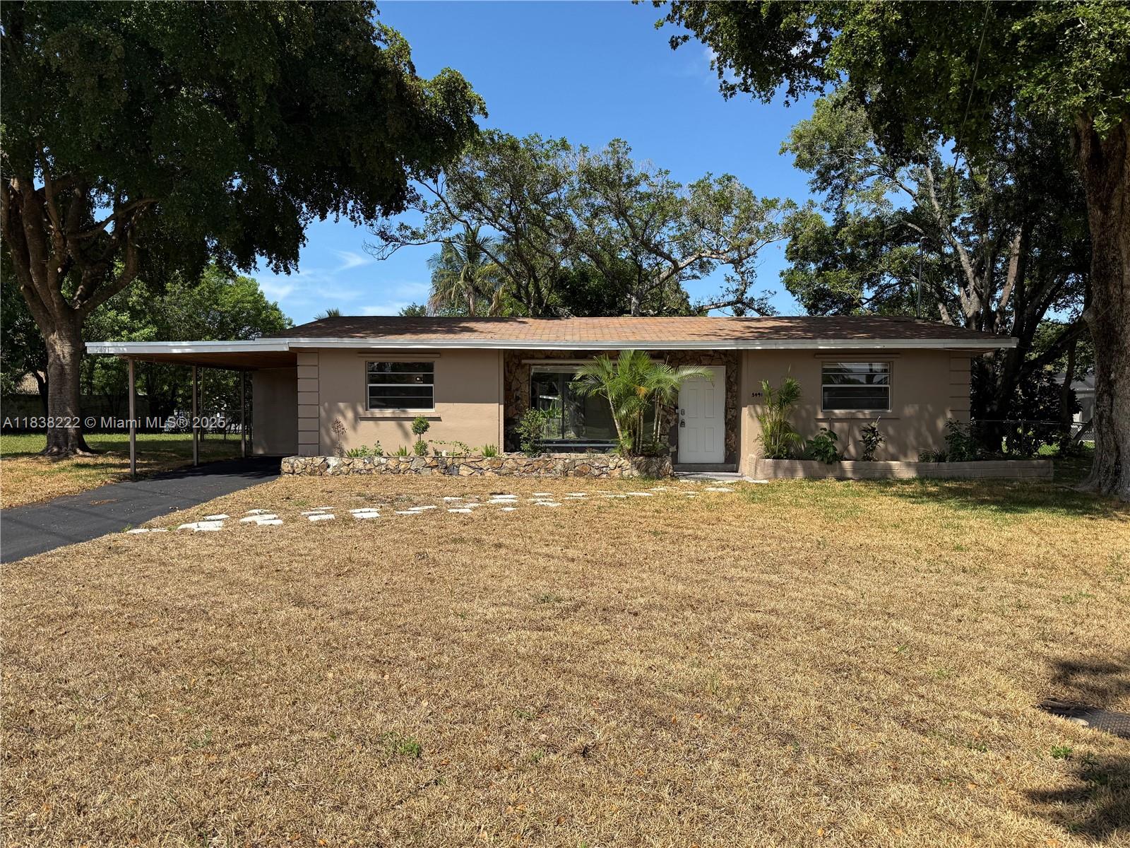 Waterfront 3BR/2BA ranch-style home on a prime corner lot! This charming residence offers vinyl wood flooring, a U-shaped eat-in kitchen with stainless steel appliances, and a spacious master bedroom with en-suite bath. The two guest bedrooms are generously sized, perfect for family or visitors. Enjoy the convenience of a laundry room, dedicated storage room, and an attached carport. The large fenced backyard features a patio ideal for outdoor entertaining or relaxing by the water. A perfect blend of comfort, function, and location. Easy to show and priced to sell.