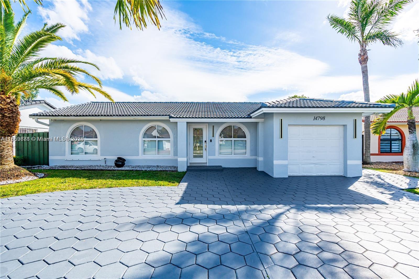 This updated 3-bedroom, 2-bathroom home features a modern kitchen, open living spaces, and a private backyard with a pool—perfect for relaxing or entertaining. The one-car garage also serves as a laundry and utility room. Landscaping and pool service are included in the rent.
