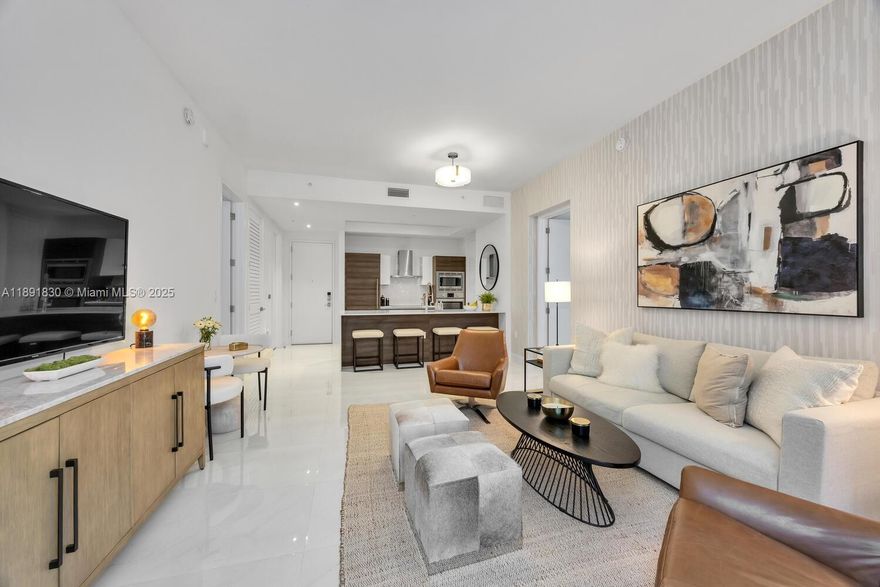 Beautiful fully furnished 2-bedroom, 2-bath condo in the heart of Coral Gables featuring a desirable split floor plan, impact windows and doors, Italkraft cabinetry, quartz countertops, Bosch appliances, Nest thermostat, and keyless entry. Includes a laundry room with washer and dryer and a large private patio on the pool deck floor—ideal for relaxing or entertaining. Enjoy resort-style amenities: heated saline pool, summer kitchen, fitness center, 24-hour concierge, security, and valet service. Steps from Merrick Park, fine dining, and boutique shopping. Includes two assigned parking spaces. Schedule your private showing today!