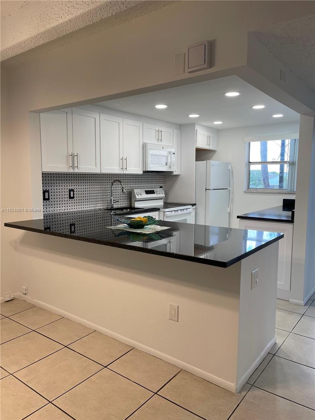 Photo of 10110 Boca Entrada Blvd #301, Boca Raton, FL 33428 (MLS # A11824001)