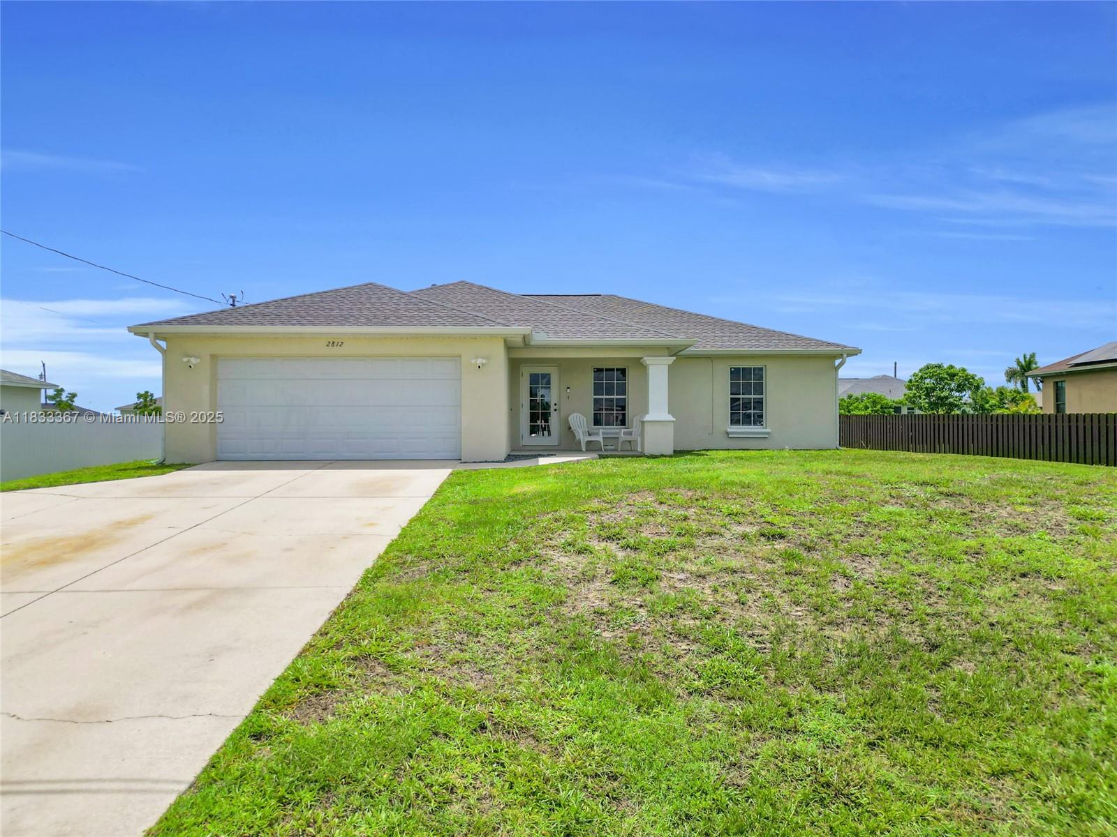 Welcome to 2812 Nelson Rd N—a 4-bedroom, 2-bath Cape Coral home built in 2006 with a new roof (2023) and A/C (2021). The open layout features light wood-style floors, neutral tones, and abundant natural light. The kitchen offers stainless steel appliances, white cabinets, and a large island. The primary suite includes a modern en-suite bath; three more bedrooms add flexibility. Outside, a covered patio overlooks a spacious backyard ideal for a pool or garden. Additional features: 2-car garage, concrete driveway, stucco siding, and indoor laundry with washer/dryer. Located near top schools, shopping, dining, and major roads, this well-maintained home suits buyers, seasonal residents, or investors.