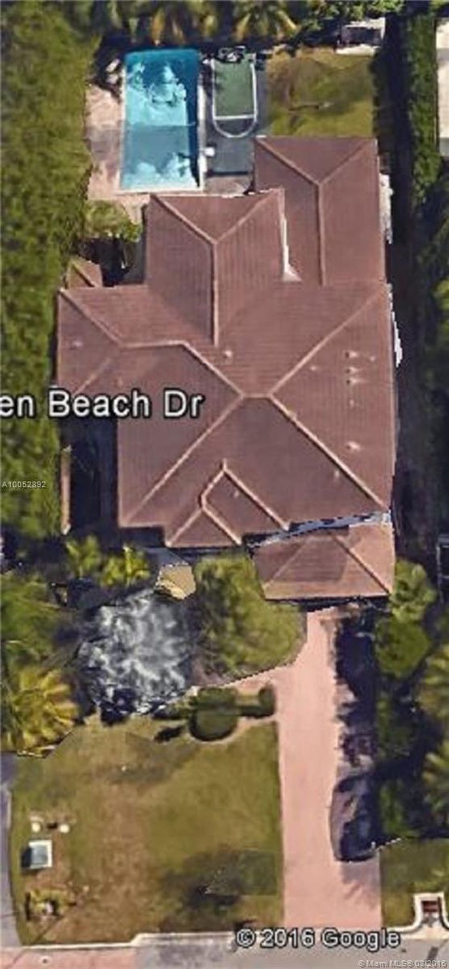 Stunning six bedroom Classic Home. High ceilings. Marble & wood floors. Stainless steel and granite kitchen. Master bedroom on first floor with access to beautiful pool deck. Impact doors & windows. Separate maids quarters. Shows like a model home.