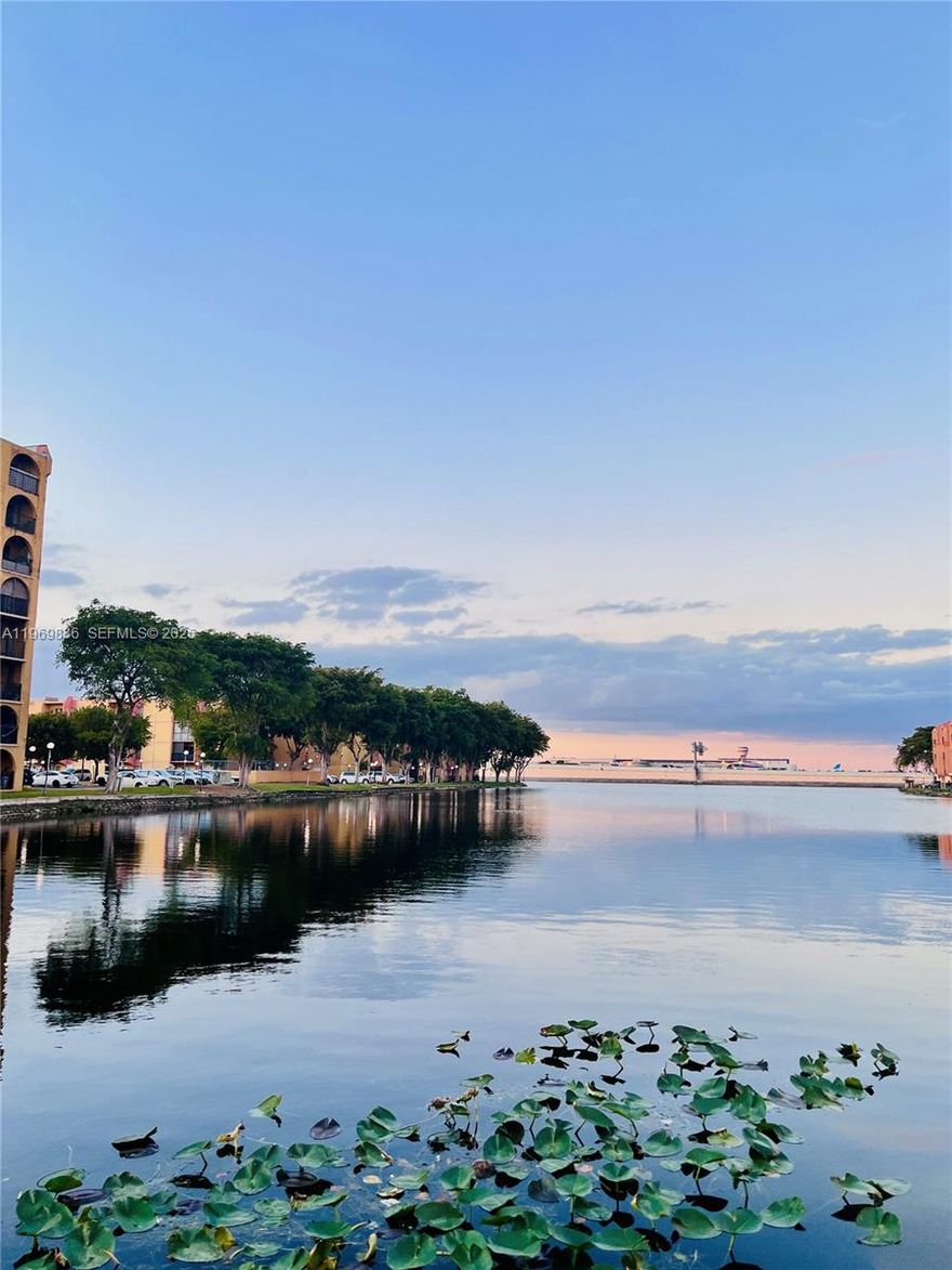 Ground-floor 1BR/1BA in Sunset Villas III, a well-established waterfront community along the Blue Lagoon in the center of Miami-Dade county. First time on the market in over 25 years, this freshly painted unit offers a solid foundation with A/C (2020), semi-updated bathroom, kitchen with excellent lower cabinets, new impact bedroom window, updated electrical outlets, new closet doors, improved A/C vents, and generous closet spaces.
The community is known for its sunset views, and natural surroundings -a rare offering at this price point. Ideal to personalize and hold in an area poised for continued growth. Located just minutes from MIA, Coral Gables, the Waterford business district, major highways, shopping & dining. Antonio Maceo Park renovated in 2025 with boat ramp for small watercraft & community center is blocks away.  Guard-gated community with 24/7 security, intercom access, cameras, pools, tennis and basketball courts, picnic areas, playground, onsite management, water included, and one parking space directly in front of the unit. Association on track with the Florida Condominium Act. No special assessments for 2026. Unit may be rented in the first year. Sold As-Is.