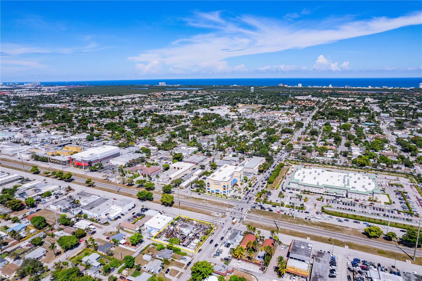 Prime Corner Lot – N. Dixie Hwy & Taft St! Approx. 21,261 SF (½ acre) with 142 ft frontage on Dixie & 150 ft on Taft. Zoned DH-3, offering major development potential; nearby parcels approved for 10-story projects w/ 70± units. Existing building features impact windows/doors, drainage, new paving & parking. Lot secured w/ 8-ft concrete wall & gated access. Suitable for a variety of commercial or residential uses. Excellent visibility & location!