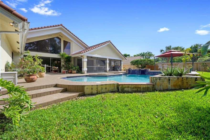 THIS ONE STORY CUSTOM OAK FOREST HOME BOASTS OVER 4100 SQUARE FEET ON A BEAUTIFUL 14,560 SF LOT,  FIVE BEDROOMS 4.5 BATHS, TWO CAR GARAGE, OVERSIZED HEATED POOL, BARREL TILE ROOF REPLACED IN 2013, GORGEOUS IMPACT DOUBLE FRONT DOORS, WOODEN FENCE REPLACED IN 2022, HEATED POOL & HOT TUB, VAULTED CEILINGS, GORGEOUS RENOVATED EXTENSIVE KITCHEN IS PERFECT FOR ENTERTAINING, QUARTZ COUNTERTOPS, LUXURY APPLIANCES INCLUDE VIKING STOVE TOP & THERMADOR DOUBLE OVEN, OPEN FLOOR PLAN, TWO BEDROOMS ARE ENSUITES, SPACIOUS MAIN BEDROOM & BATH, FENCE WAS REPLACED.  A FABULOUS FLOOR PLAN.  HOME WAS BUILT & PREVIOUSLY OWNED BY THE BUILDER OF MANY HOMES IN OAK FOREST.