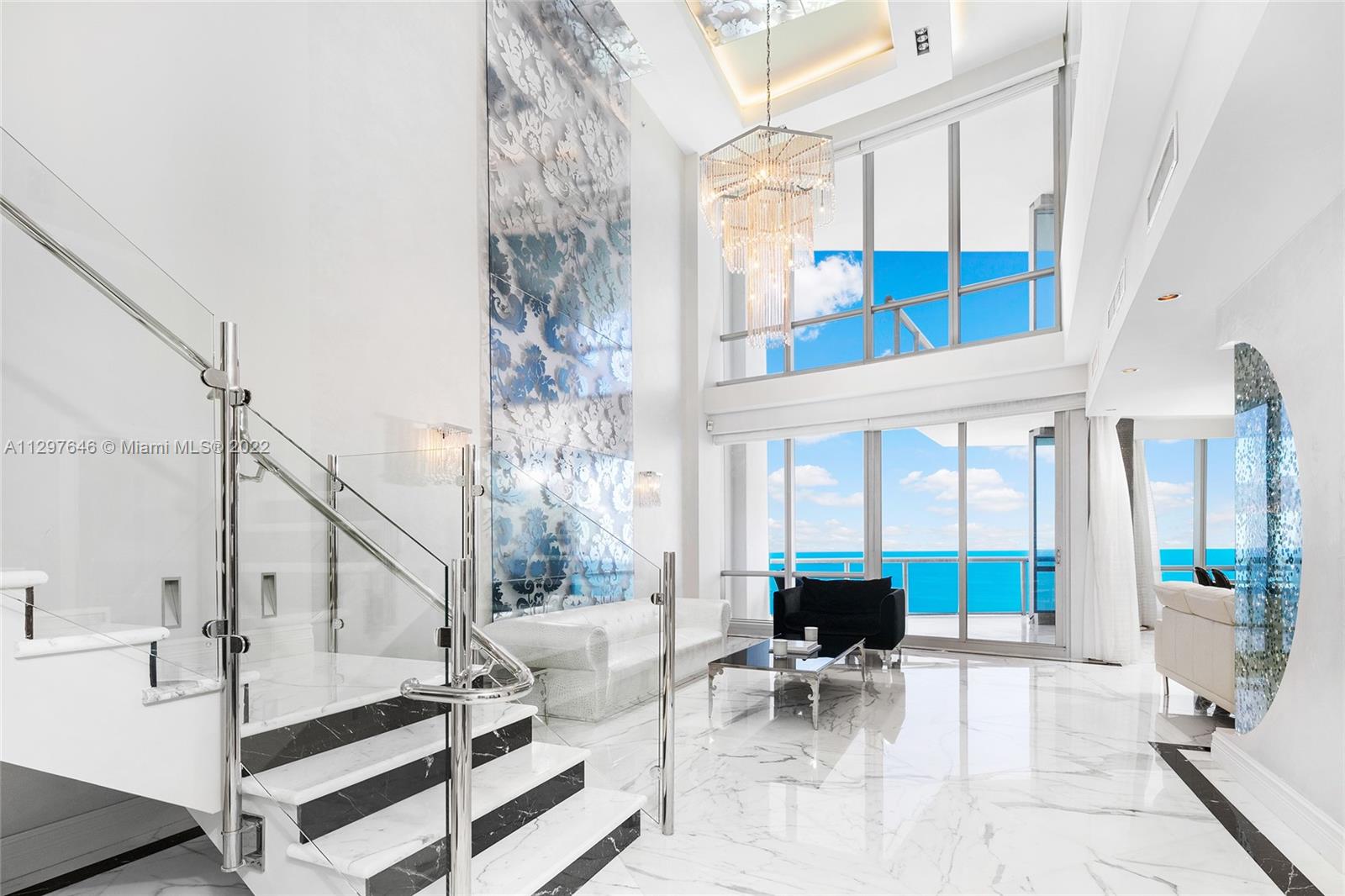This fabulous 2-story Lower PH in Sunny Isles at the Jade Ocean was designed by World renowned architect Carlos Ott. Private foyer off elevator with double entrance doors, this 4BR/4+1BA unit boasts soaring 20FT plus ceilings & spans over 4,303 SF of interior spaces & numerous terraces that overlook the ocean with magnificent sunrises and breathtaking sunsets. Exquisite 36”x36” Calcutta Gold select marble floors throughout w/Black Marquina marble borders & accents. Sleek chef’s kitchen sports top-of-the-line Subzero & Miele appliances, center island. Beautiful oceanside principal suite & bath. Creston system, electric blinds/blackouts, hurricane impact doors/windows & separate laundry room. Jade Ocean is a full-service building, including concierge, valet parking & more. Sold unfurnished.