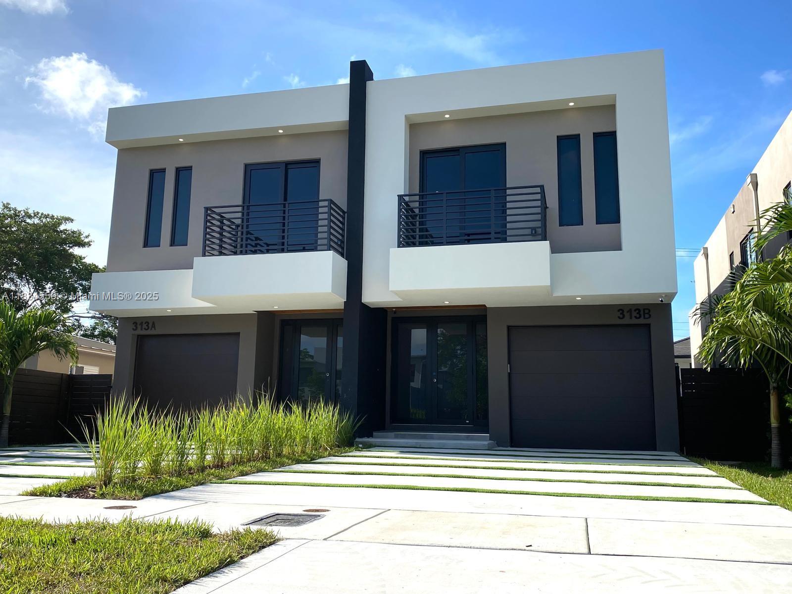 Located on one of the most beautiful blocks in Tarpon River, this 2025 townhouse is surrounded by new homes designed by the same architect, creating a cohesive and modern streetscape. Fee Simple ownership with no HOA fees. This home features 3 bedrooms, each with its own en-suite bathroom, and 2,667 total sq. ft. It offers an open-concept layout, 9ft ceilings, gourmet kitchen with SS appliances, quartz countertops, and a wine bar. A standout feature is the 56-ft-deep driveway, allowing for parking up to 4 vehicles, plus a private 1-car garage—a rare find in a duplex. EV charging connection installed. Enjoy balconies at both the front and rear of the home. Additional features include impact windows and doors, Nest thermostat, Ring doorbell, and a security camera system. Move-in ready!
