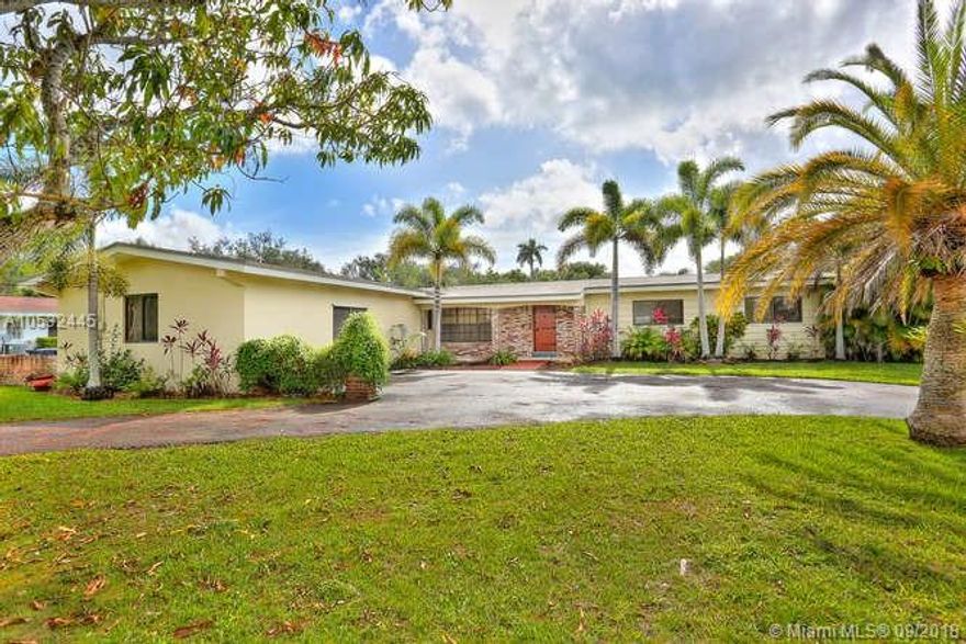 Fantastic opportunity to develop your dream home on a gorgeous acre in a prestigious neighborhood of expensive homes. Listings are rare in this pocket. House is in good condition and features a newer roof, impact windows, nice family room overlooking a very large pool. Remodel existing home or build new. Hurry this one will go fast. Easy to show.