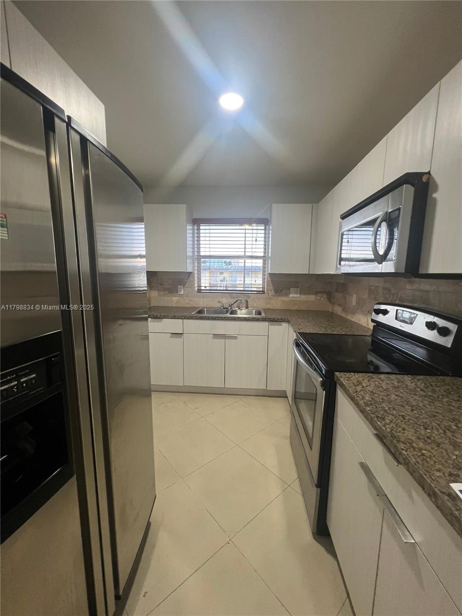 VILLAGE AT DADELAND CONDO - Residential