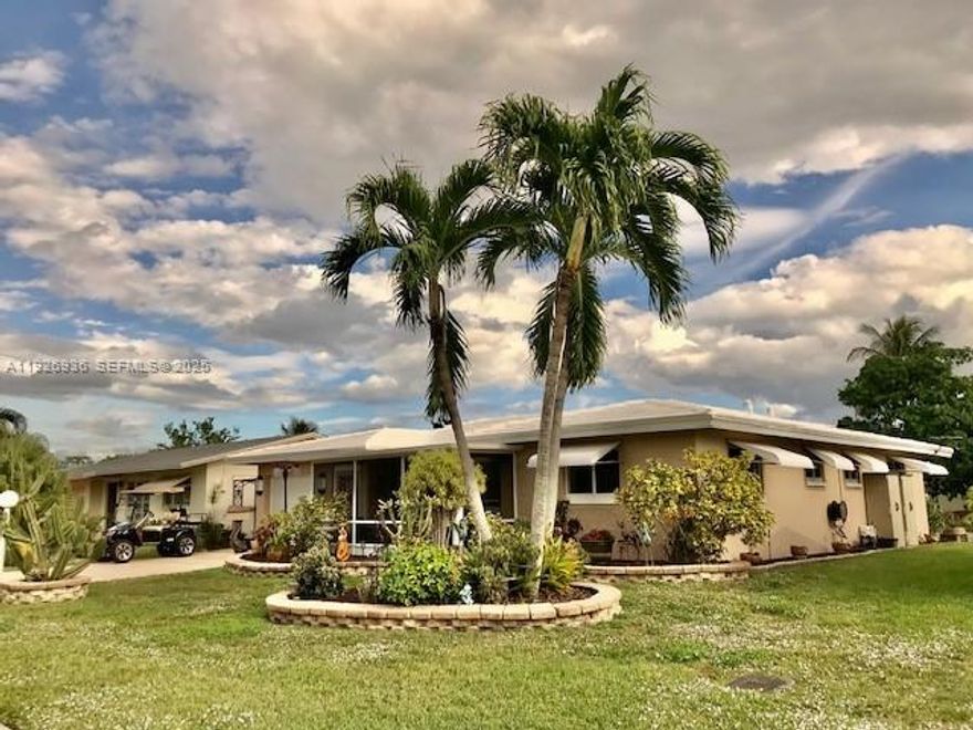 Motivated Seller! This Beautiful perfectly maintained home in Mainlands of Tamarac features 2 bedrooms 2 baths, enclosed front porch and large Florida Room overlooking the garden and lake. Paved stone terrace. Updated kitchen with marble countertop. Updated bathrooms. Full hurricane impact windows and garage door. New Electric panel. New A/C . Roof is maintained every year. Low HOA includes lawn service. Sellers are snowbirds so it has barely been lived in. Buyer/OwnerMust be 55 +, any other Members must be 18 Yrs+. Easy to show. Ready to move in!