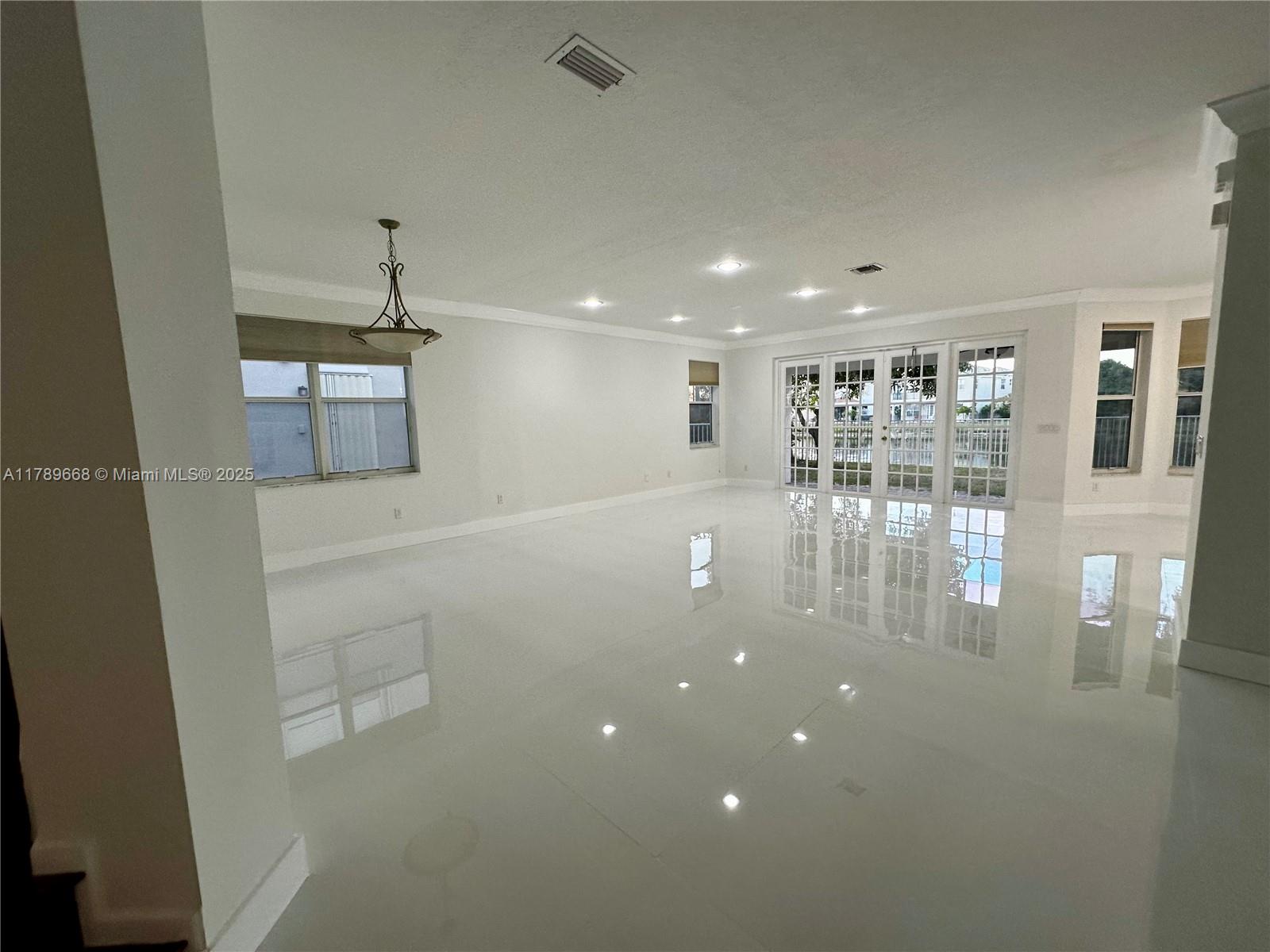 TOTAL REMODEL UNIT - BEST DEAL IN WELLINGTON in luxury Wellington community of Olympia. Huge 6 bed 4 bath with nearly 3,700sq ft under AC and 4,500 total sq ft. TOTAL REMODEL with new white porcelain tiles downstairs and wood floors upstairs. NEW AC, appliances, vanities and just painted inside and out. Roof in great condition. LAKE views are amazing. 24 hour guard gated community with Resort style amenities such as huge pool, tennis and pickle ball, amazing weight room, indoor and outdoor basketball courts and beautiful club party rooms area. Quiet tree lined streets with very well run community. Very close to Wellington mall with Macy and many other stores, restaurants and community center. 15 min to Downtown West Palm Beach and City Center and 20 minutes to Beaches. VERY EASY TO​​‌​​​​‌​‌​​​‌‌​​​‌‌‌​​‌​​‌‌​​​​ SHOW.