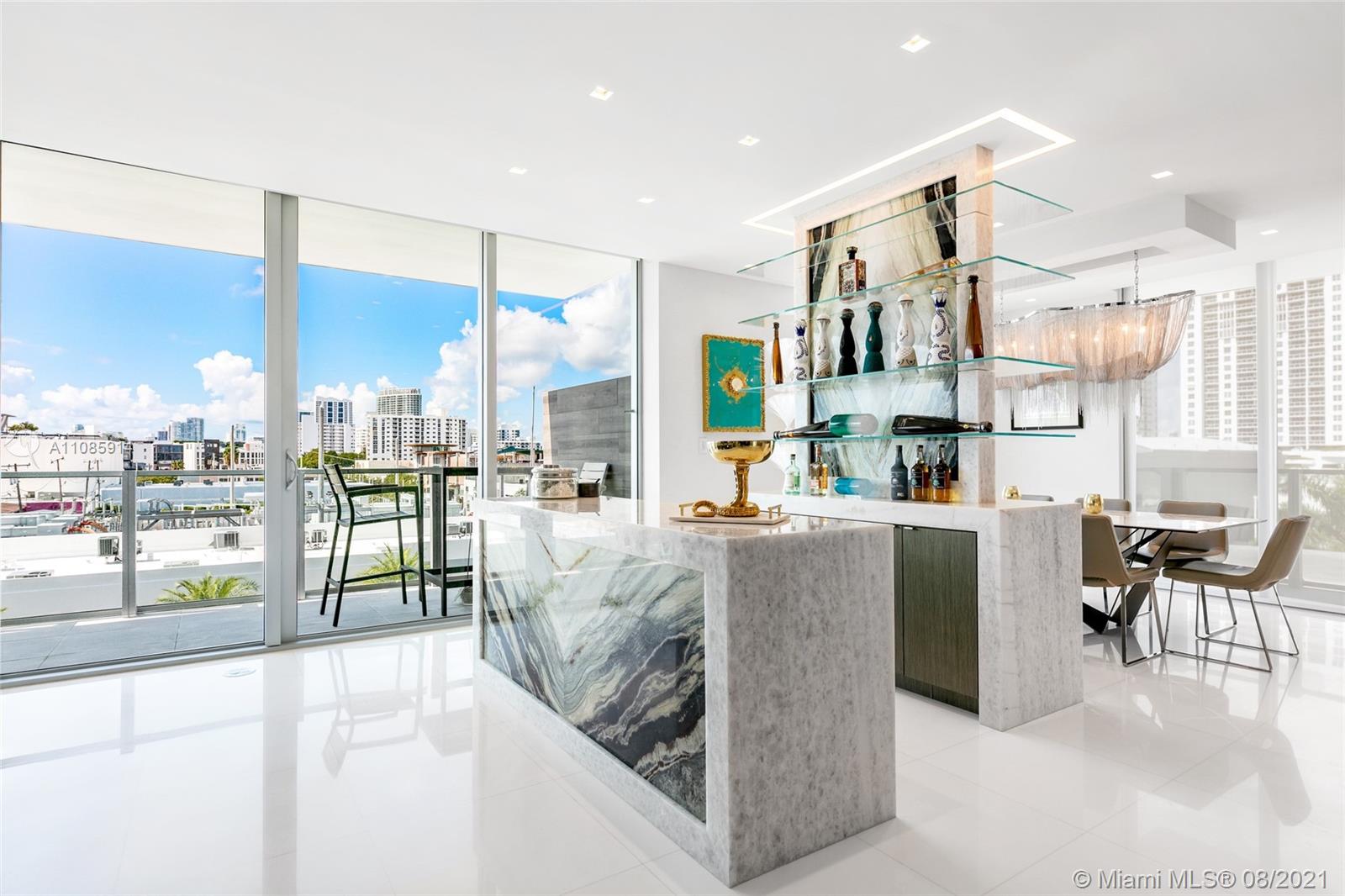 Penthouse 8 at Palau is in the prime neighborhood of Sunset Harbour offers 180’ views of the bay, city and sunsets. This contemporary corner residence boasts 3 bedrooms, 3.5 bathrooms and a private rooftop terrace. Features include custom built in surround sound system, white Thassos marble floors, luxurious master bath with Calacatta marble, custom Italian Closets, custom electric shades. Enjoy entertaining with a remarkable custom built in marble bar. The private rooftop with sunset and direct bay views and has direct access to the pool. Walking distance to famous Lincoln Rd, Sunset Harbour boasts trendy shops, intimate restaurants, fitness centers, juice bars, marina and beautiful views along the bayside
