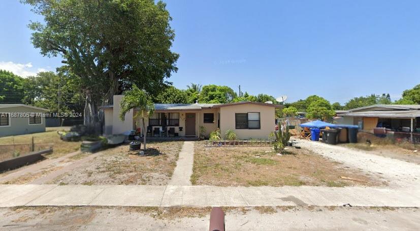 UNAPPROVED SHORT SALE. Single-story home located at 1001 NW 13th Ct, Fort Lauderdale, FL 33311. This property features a spacious front yard with a concrete walkway, mature trees, and plenty of space for outdoor enhancements. With a simple yet practical design, this home offers a cozy covered front porch area, ideal for enjoying the Florida weather. Positioned in a quiet neighborhood, it provides ample driveway parking space. Great investment opportunity or starter home with potential for updates and landscaping improvements. PLEASE CALL LISTING OFFICE FOR MORE INFORMATION - Do not disturb the Tenant!!!