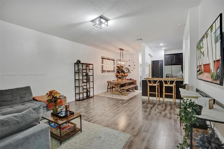 Welcome to Montclair in Miramar! This desirable Moreno model features 3 levels, 3 bedrooms, 3.5 baths, and a full living area on the main level—ideal for a man cave or family room. Enjoy a spacious kitchen with 42” cabinets, granite countertops, and stainless steel appliances. The HVAC system was replaced in 2022. Beautiful floors flow throughout the home, and the owner's suite offers his-and-hers closets. Additional highlights include a 2-car garage and well-designed layout perfect for comfortable living and entertaining. Located in a gated community with great amenities and easy access to major highways, shopping, and dining. Garage is equipped with epoxy floors and EV outlet. Security system does not convey with the purchase of the home. Please see attachments for HOA rules and regulations.