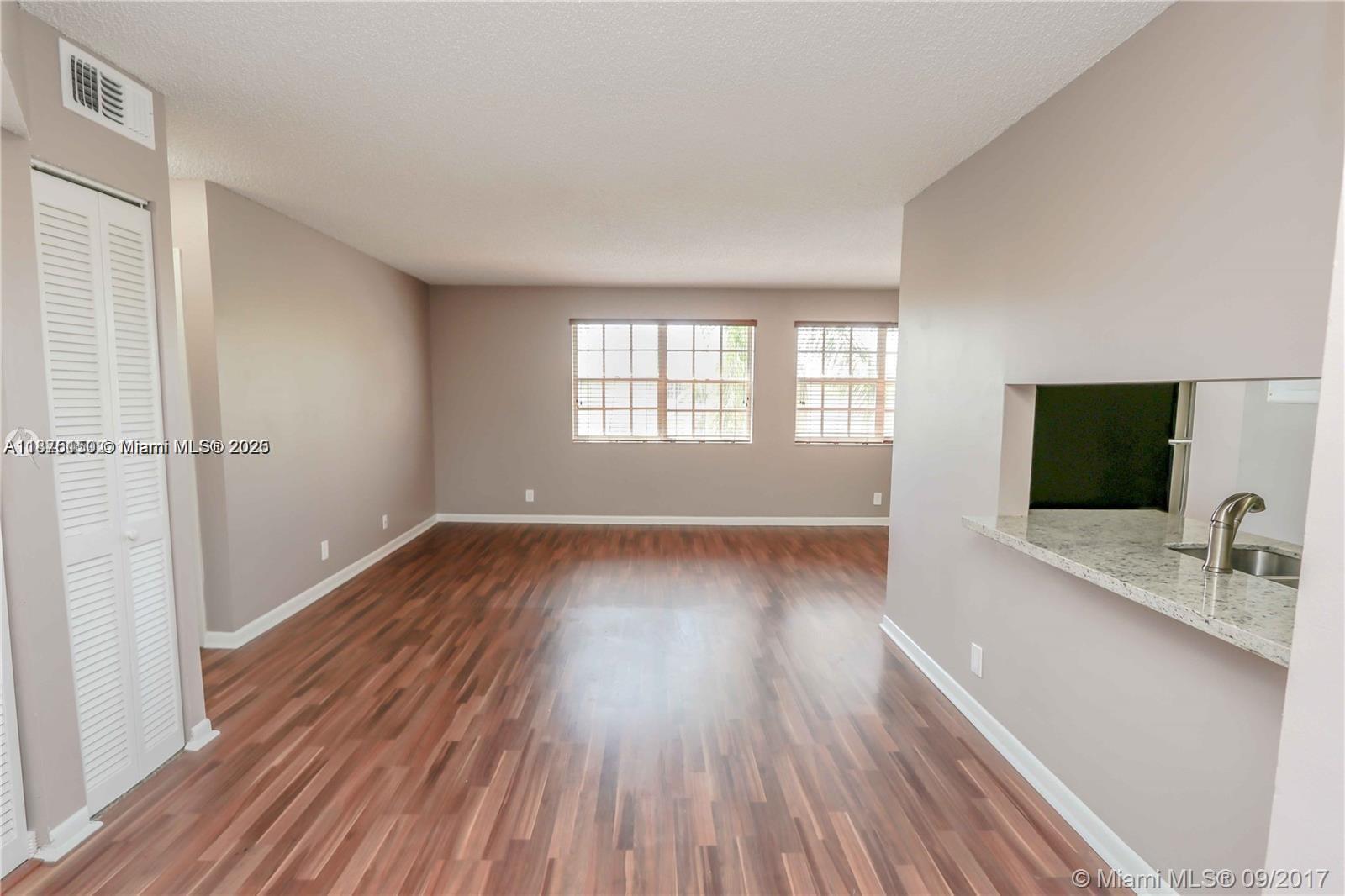 Spacious and luminous 2-bedroom, 2-bathroom condo located in the beautiful community of Windmill Lakes. The unit offers an open layout with abundant natural light, creating a comfortable and inviting living space. Community amenities include: Swimming pool, Fitness center,Clubhouse,Tennis courts,Lake views and walking paths, Ample parking. Conveniently located near shopping centers, restaurants, schools, and parks. Easy access to major highways and just a short drive to beaches and entertainment areas. *washer and dryer inside the unit*