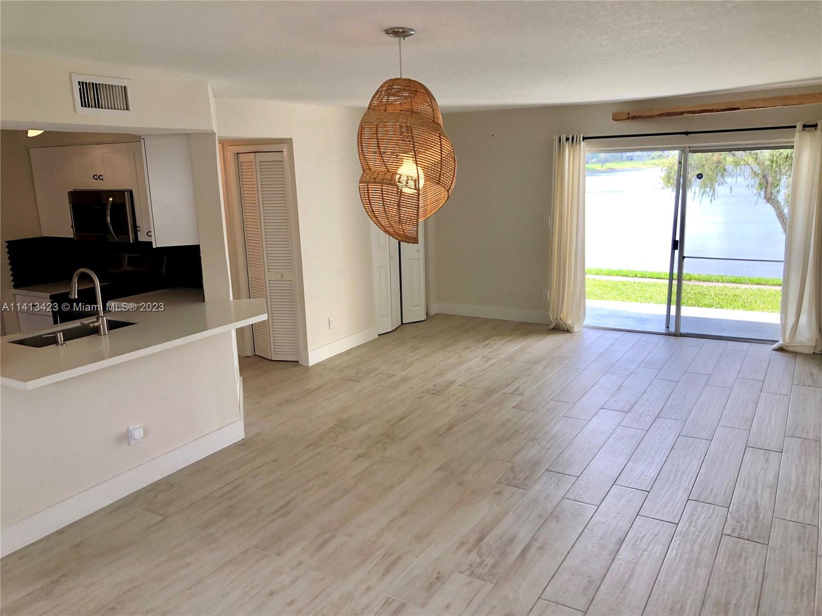 Great ground floor apartment for rent with lakeview. 1bed+1bath. Large luminous living room with sliding window facing lake & own patio. Thoroughly UPDATED UNIT. Porcelain tiled floors. Renewed kitchen with quartz counter tops. Sunken SS Sink. Soft Close Cabinetry. Extended Counter for eat at bar. Stainless Steel appliances. Washer/dryer inside. Nest thermostat with Air Conditioner newer. Upgraded bathroom with glass enclosure over sized shower head. Large master with walk in closet, lots of storage space. Quiet nice gated community: Pool and pooldeck by the lake, Exercise room, Club House. ::Recorded video tour available:: Located in a convenient area: supermarket, pharmacy, restaurantes, gas stations, close to I95 & Turnpike. Req: 1st month rent + 2mo security deposit, 650+ CS.