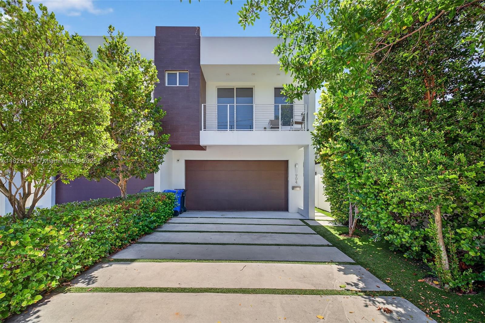 This luxury townhome in the heart of Victoria Park features over 2,000 SF of living space and a 2-car garage. Built in 2017, this modern residence boasts high-end finishes, 9' ceilings, imported porcelain tile floors, a spacious laundry room, walk-in closets, and a private balcony and yard with smart grass. Enjoy ultimate privacy with only one neighbor. Prime location just minutes from the Brightline station, Las Olas, downtown, beaches, Fort Lauderdale International Airport and more.