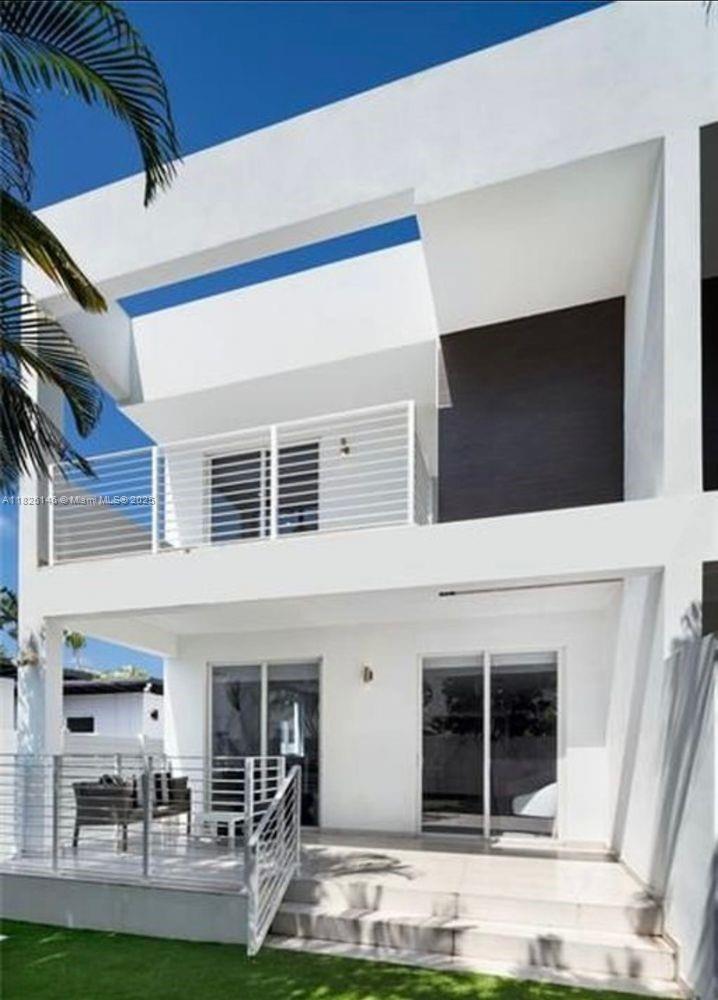 This luxury townhome in the heart of Victoria Park features over 2,000 SF of living space and a 2-car garage. Built in 2017, this modern residence boasts high-end finishes, 9' ceilings, imported porcelain tile floors, a spacious laundry room, walk-in closets, and a private balcony and yard with smart grass. Enjoy ultimate privacy with only one neighbor. Prime location just minutes from the Brightline station, Las Olas, downtown, beaches, Fort Lauderdale International Airport and more.