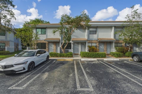 Photo of 9853 Riverside Dr #8-24, Coral Springs, FL 33071 (MLS # A11974081)