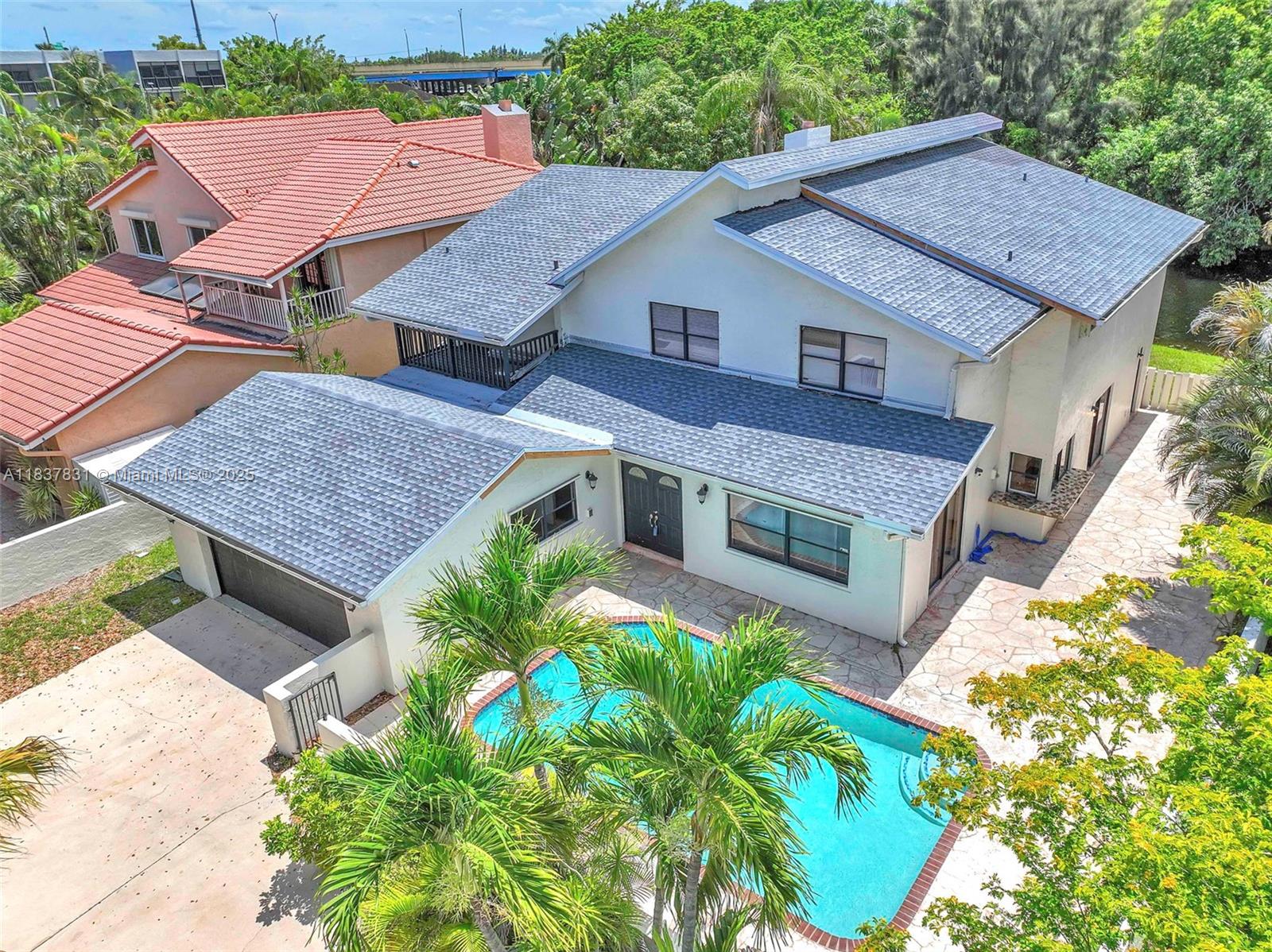 *Investor Special/Handyman Opportunity in the Heart of Plantation!* This spacious home needs updating & rehab but offers incredible potential. With a brand-new roof & recently resurfaced pool, the heavy lifting has already begun—now it’s your turn to add value & vision. Featuring 6 oversized bedrooms, den, office, and 4.5 bathrooms, there's plenty of space to reimagine. The primary bedroom and office are on the 1st floor. Enjoy lake views from the backyard & a private pool in the front. NO HOA makes this ideal for investors or Airbnb potential. A fully updated home just a few doors down is listed at $1.199M and currently under contract, offering a huge value-add opportunity. Bring your tools and your vision—this is the one you’ve been waiting for!