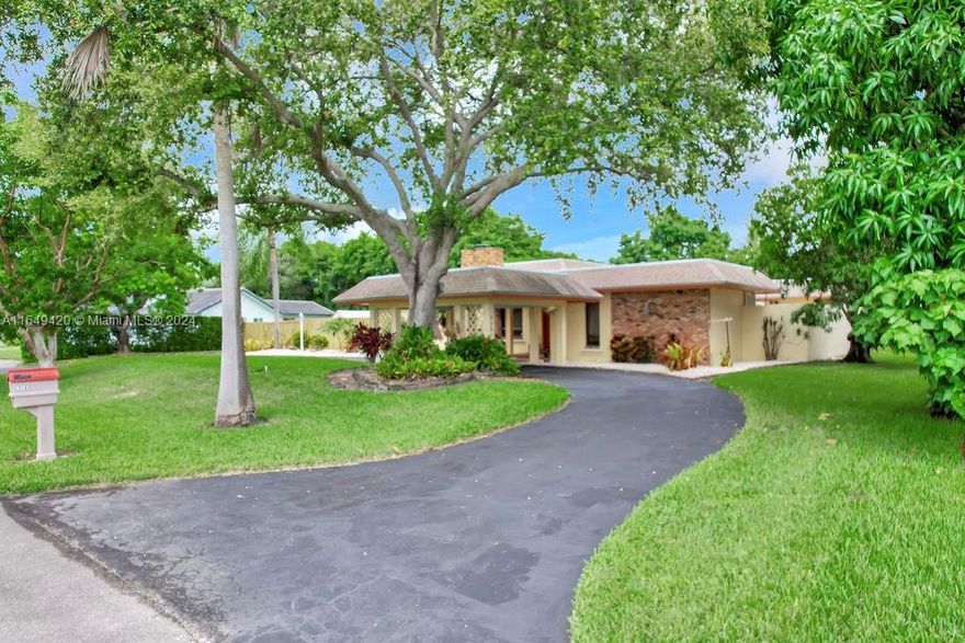 Welcome to this charming 3-bedroom, 3-bathroom home that offers generously sized rooms and abundant closet space throughout. The property boasts a covered circular driveway and an automated gate with additional parking, ensuring convenience and security. Inside, you'll find a large family room with a cozy fireplace, perfect for relaxing, and an additional living room ideal for gatherings. The home features a full wet bar with a refrigerator, making entertaining a breeze. Additional highlights include an inside laundry room with a dedicated office space. Hurricane shutters for all windows and doors, offering added peace of mind. The serene yard is adorned with mature fruit trees, creating a serene outdoor oasis.
MLS information is intended to be accurate but cannot be guaranteed.