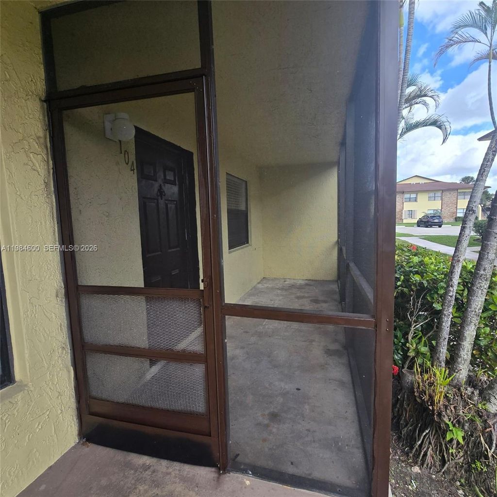 Photo of 10020 Winding Lake Rd #104, Sunrise, FL 33351 (MLS # A11984600)