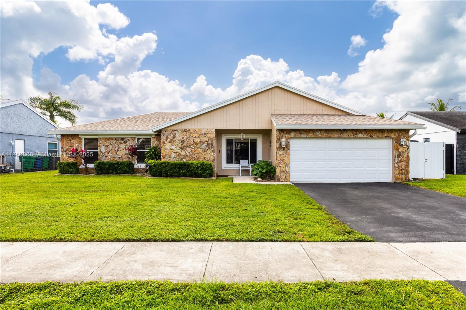 Beautiful home in one of Cooper City’s most desirable neighborhoods! This spacious layout features vaulted ceilings, a formal living room, and a dining area with a breakfast bar overlooking the kitchen. The bright Florida room opens to a pool and large backyard with peaceful lake views—ideal for relaxing or entertaining. Upgrades include a 2023 roof, 2025 pool pump, 2022 water heater, 2019 A/C, partial impact windows, and window shutters. No HOA and walking distance to Griffin Elementary, with top-rated Pioneer Middle and Cooper City High nearby. Close to family-friendly restaurants, parks like Tree Tops and Flamingo Gardens, and the Hard Rock for dining and events.