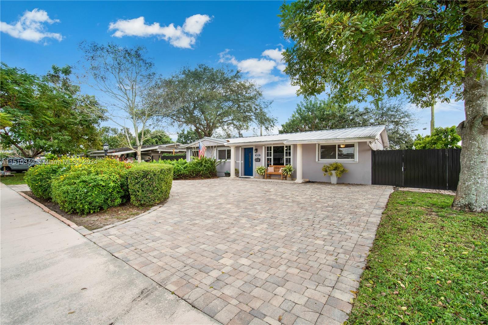 Welcome Home! Stunning 4 bed, 3 bath turn-key home with remodeled kitchen and bathrooms. A circular driveway that is tiled. Metal roof installed 3 years ago as per seller   The backyard has landscaping a backyard deck, a gazebo, and a retractable awning. There is also a utility room/ shed in the backyard—a kitchenette bar inside of in-law's quarters.  The house has a tankless water heater.  Impact doors and windows paired with accordion shutters for extra protection. Expressways, Schools, and Dog parks are conveniently located nearby.