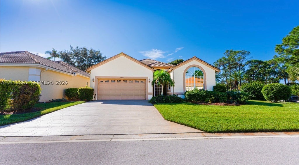 Photo of 1528 SE Holyrood Ln, Port St Lucie, FL 34952 (MLS # A12112861)