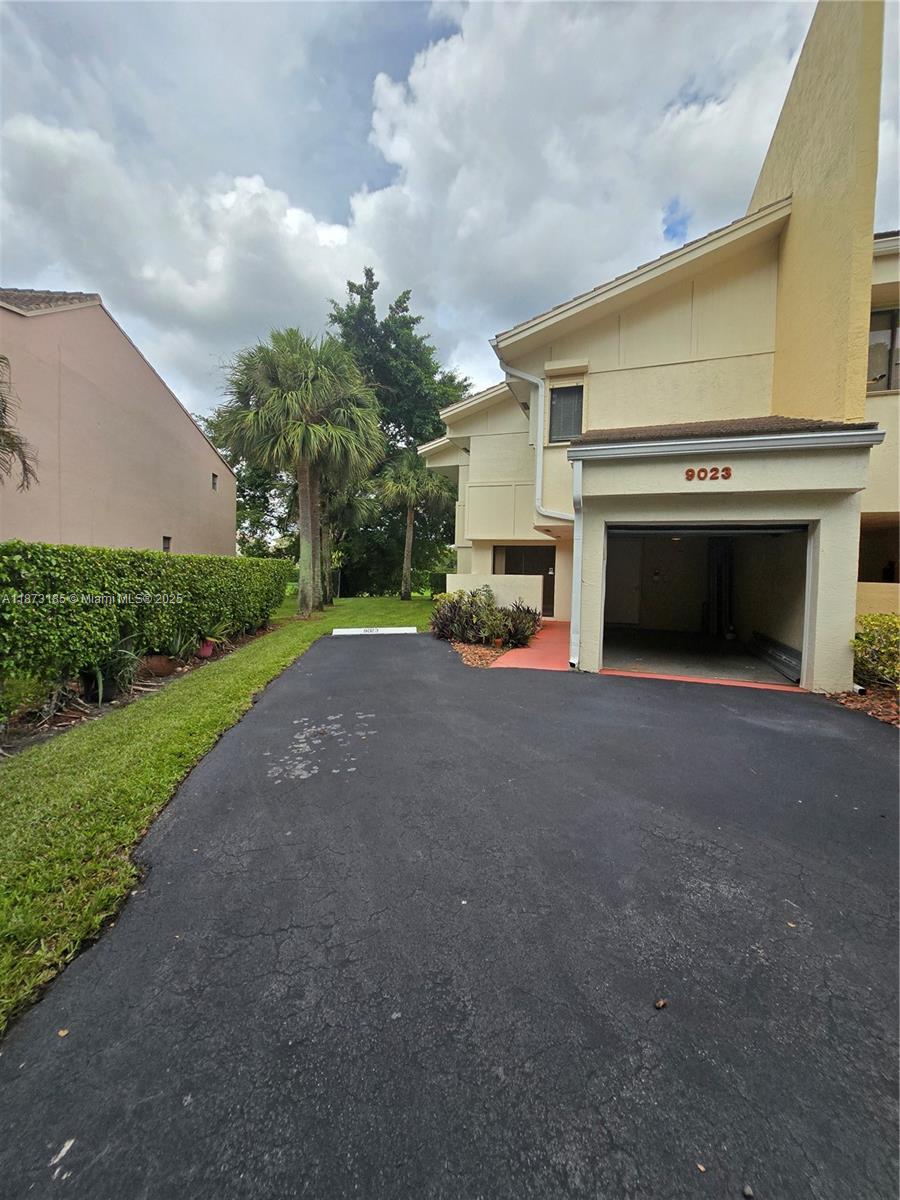 2-story townhouse with beautiful canal views. This property features a full bedroom and bathroom on the first floor, perfect for guests or family. Upstairs you will find the master suite with its own bath, an additional bedroom, and a hall bathroom. The home offers a spacious custom kitchen with wood cabinets, granite countertops, and deluxe appliances. Includes 1-car garage with automatic door opener and exterior keypad, plus space to park 3 additional cars. Washer and dryer are conveniently located on the second floor. Maintenance includes water. Enjoy functional home with plenty of natural light and a peaceful canal view.