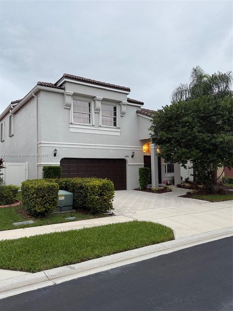 Photo of 1471 NW 159th Ave, Pembroke Pines, FL 33028 (MLS # A11920866)