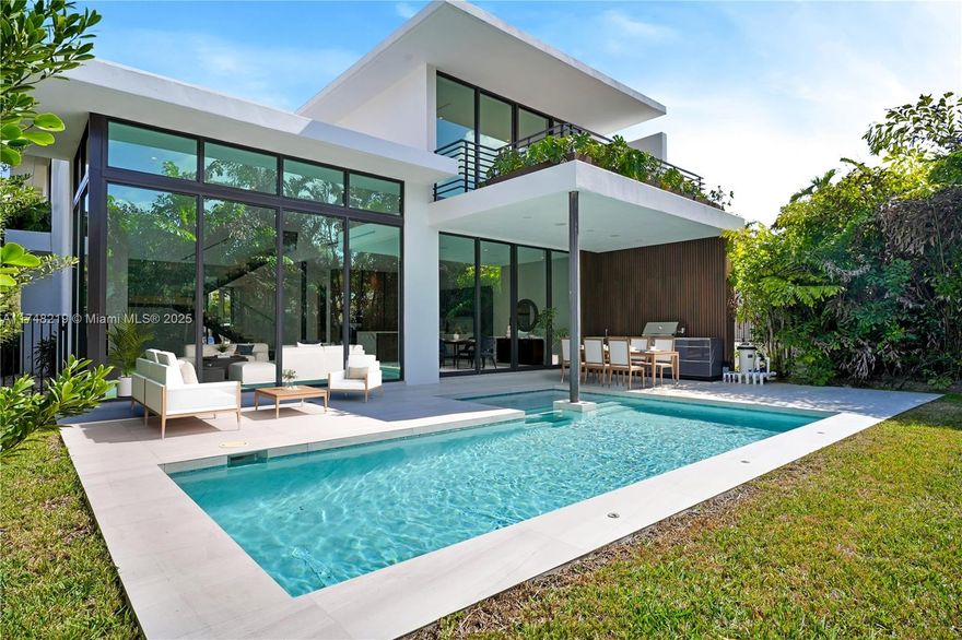 Brand new, modern architectural masterpiece located in The Roads, Miami. This 5/4.5 home showcases exquisite Italian porcelain floors & floor-to-ceiling windows. The gourmet kitchen features Veneta Cucine cabinets, JennAir appliances, and a Versace-branded Italian countertop. Designed for elegance & durability, it boasts a concrete roof & expansive open spaces that allow natural light to flow in. Spacious bedrooms include a lavish primary suite with huge walk-in closet and ensuite bath. Venture outside to a covered terrace & summer kitchen, while overlooking the pool & lush landscaping. Just minutes from Brickell, Downtown, Coconut Grove, Key Biscayne, and easy access to I-95, this home offers the perfect blend of privacy and convenience in one of Miami's most coveted neighborhoods.