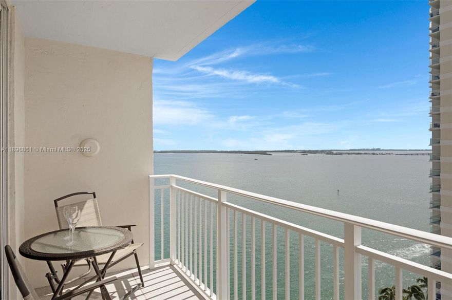 Live the island lifestyle on prestigious, private Brickell Key. This Isola residence offers stunning views of Biscayne Bay, the ocean, and the Brickell skyline. Features include an open-concept kitchen with granite countertops, newer stainless steel appliances and A/C system, luxury vinyl floors, and in-unit washer/dryer. Enjoy newly updated resort-style amenities: heated pool and spa, BBQ areas, waterfront party space, mini-golf, and tennis/pickleball courts. Additional amenities include 24-hour concierge, valet, conference room and business center, and 24-hour convenience store. Stroll or jog along the waterfront path, cafés, restaurants, and markets, just minutes from Brickell City Centre, airport, Miami Beach, Coral Gables, and Key Biscayne. Special assessment fully paid!