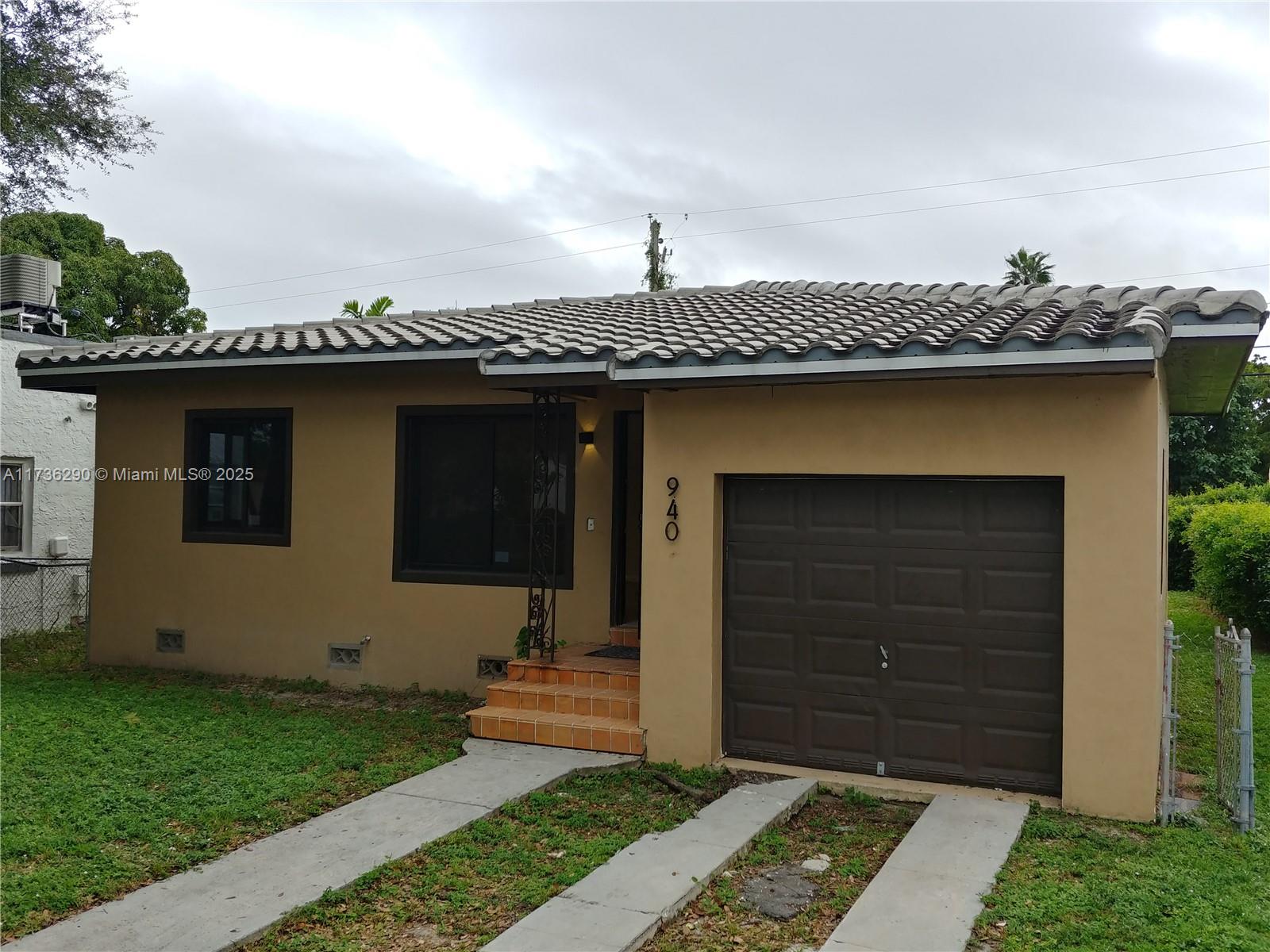 Renovated 3 bedroom 1 bath w/ rare attached garage! Tenant occupied at $3,231, but tenant is moving to North Carolina at the end of the lease - May 3, 2025. New hurricane windows, tile roof, flooring, custom kitchen w/ stainless appliances & quartz countertops, & under cabinet lighting. Updated bath w/ shower panel, large primary bedroom w/ windows on three sides & exit to backyard. Recessed lights & ceiling fans. Garage includes a laundry area, room for Tesla charger, 1 car + extra storage. Additional parking for 1 car in the driveway. Backyard is fenced & has room for more parking, deck, pool, or addition. Opportunity Zone property.
