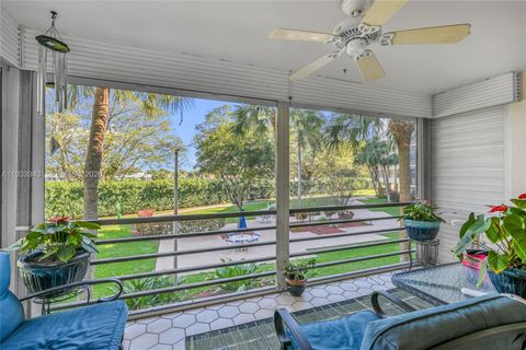 Photo of 1400 Saint Charles Pl #207, Pembroke Pines, FL 33026 (MLS # A11933943)