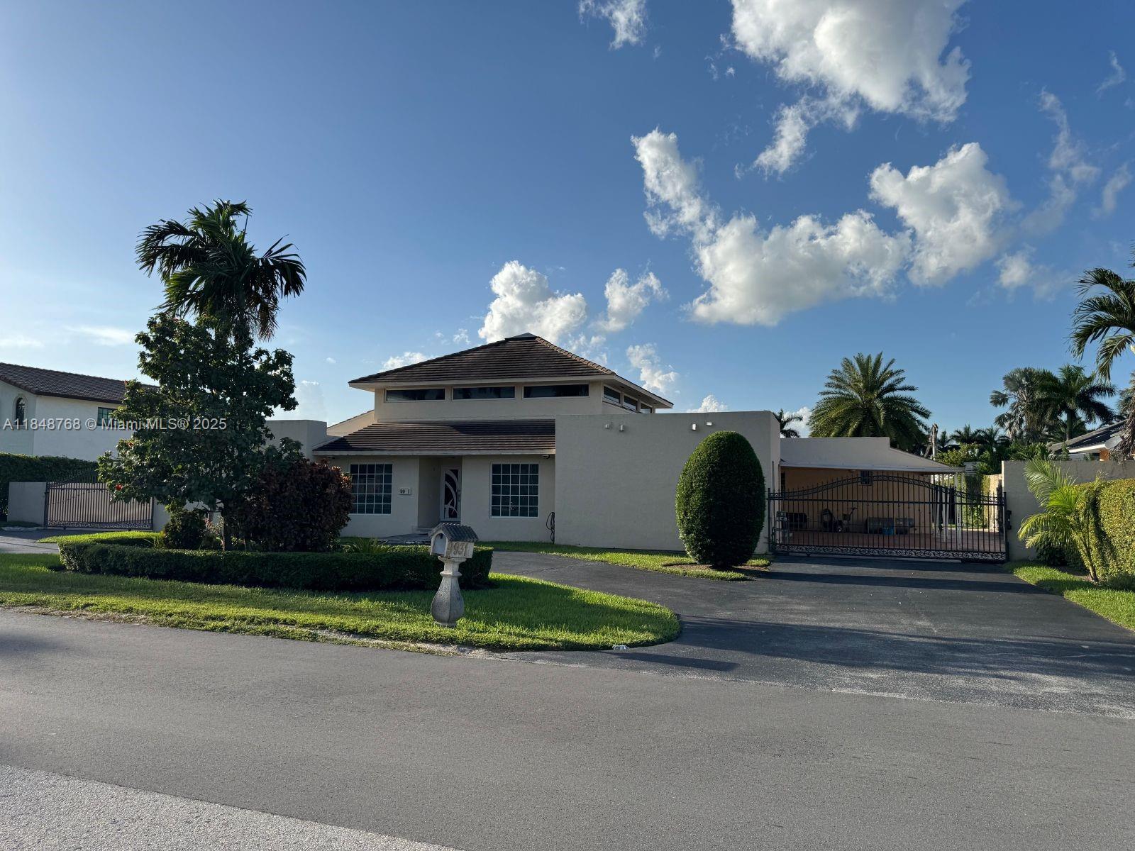 Welcome to this stunning single-family home located in Hialeah Estate Gardens! This property features 6 bedrooms and 3 bathrooms. The spacious interior includes a large and beautiful living room, dining room, family room, and a gorgeous wood-paneled bar with plenty of natural light and porcelain floors throughout. The kitchen is fully equipped with a stove, oven, microwave, dishwasher, stainless steel refrigerator, and exotic granite countertops. The home also has a new roof that is only 5 years old and three air conditioning units.
It boasts an enormous backyard, mostly paved, with a wooden pergola that includes a sink, a green area, and a fruit tree. There is ample space in the driveway to park cars, a boat, and/or an RV.
Come visit us and don’t miss to make this your dream home!