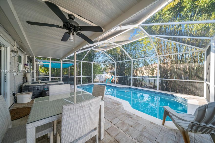 Welcome to this beautifully updated 3-bedroom, 2-bath pool home in Fort Myers, where privacy, comfort, and functionality come together seamlessly. Surrounded by mature bamboo landscaping, the fully fenced backyard offers a private retreat perfect for relaxing or entertaining year-round.

The screened-in lanai features a sparkling pool and spa with generous covered and open-air areas ideal for outdoor dining, gatherings, or peaceful evenings by the water. A shaded pergola creates the perfect barbecue space, expanding the outdoor living experience and embracing the Southwest Florida lifestyle.

Inside, the bright and open layout showcases a renovated kitchen with granite countertops, modern cabinetry, stainless steel appliances, and a functional island ideal for everyday living. Updated bathrooms, tile and carpet flooring, ceiling fans, and abundant natural light enhance the home’s move-in-ready appeal.

Additional highlights include a two-car garage with laundry area, spacious lot, and NO HOA—offering flexibility for a primary residence, second home, or investment opportunity.

Conveniently located near shopping, dining, schools, and major roadways, this property offers both tranquility and accessibility. Don’t miss this rare opportunity to own a private pool home in a desirable Fort Myers location.