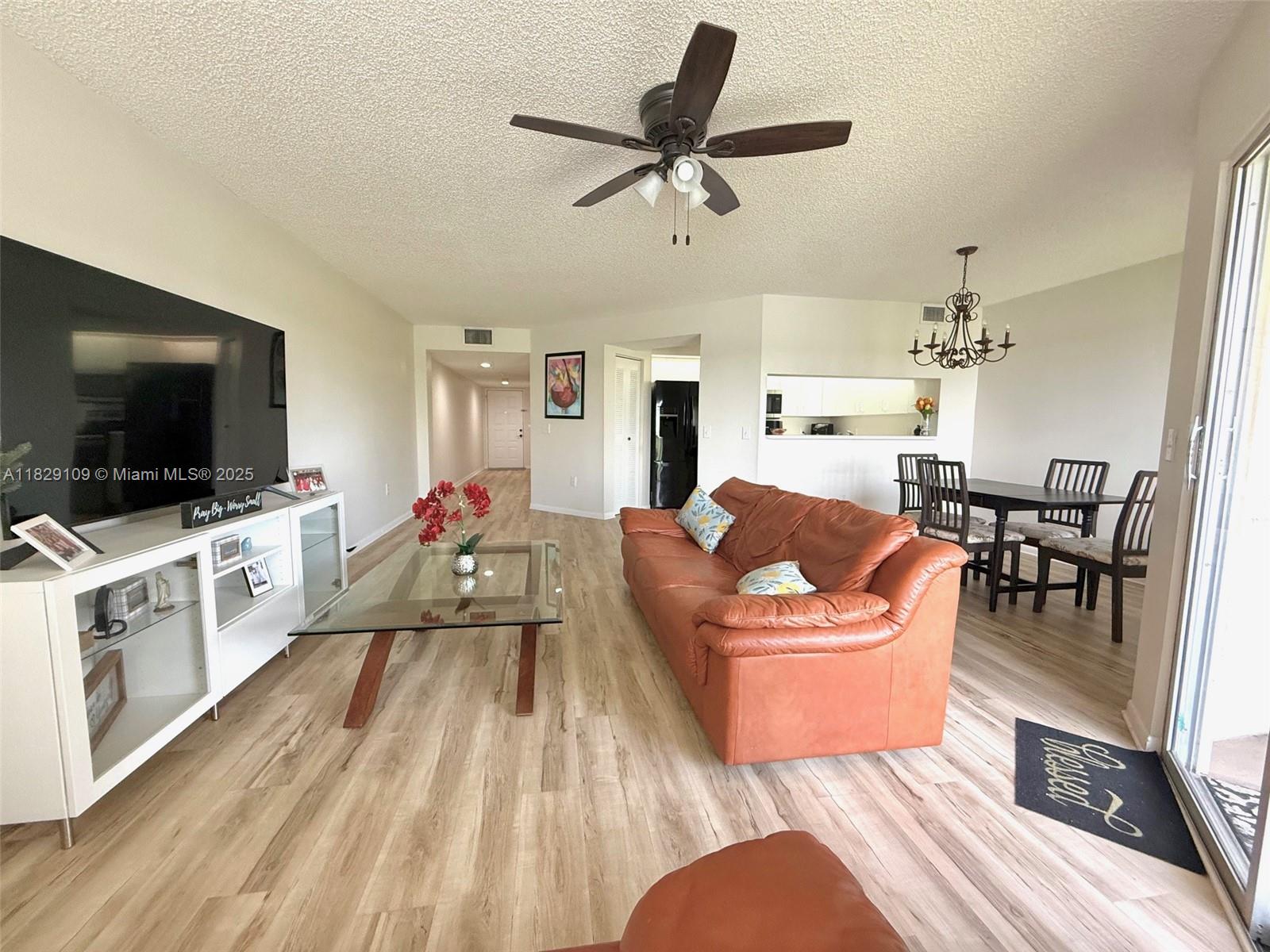 Charming 1-bedroom, 1.5-bath condo with stunning lake views! This bright, clean unit features a private balcony overlooking the peaceful lake, perfect for relaxing. Enjoy the convenience of an in-unit washer and dryer, recently painted interiors, and easy-to-maintain wood-look vinyl laminate flooring. The kitchen offers a breakfast bar and pantry for extra storage. Located on the quiet 4th floor. The community provides incredible resort-style amenities including: a state-of-the-art clubhouse, 1000-seat theater with free weekly movies, billiard room, two fitness centers, security gate, 27 pools, 18 tennis courts, and a courtesy bus. Association dues cover water, trash, sewer, cable, internet, clubs. Live the lifestyle you deserve!