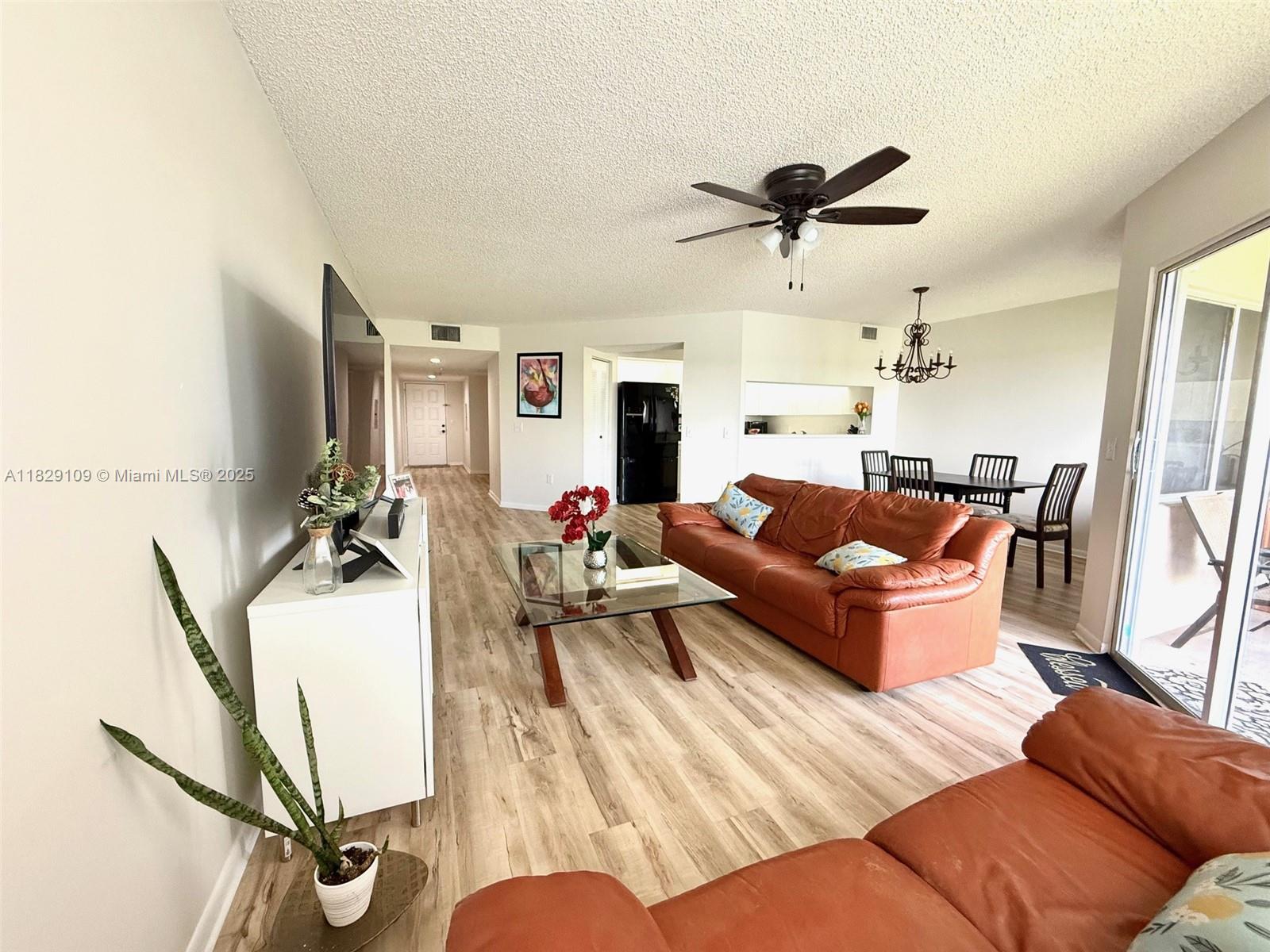 Charming 1-bedroom, 1.5-bath condo with stunning lake views! This bright, clean unit features a private balcony overlooking the peaceful lake, perfect for relaxing. Enjoy the convenience of an in-unit washer and dryer, recently painted interiors, and easy-to-maintain wood-look vinyl laminate flooring. The kitchen offers a breakfast bar and pantry for extra storage. Located on the quiet 4th floor. The community provides incredible resort-style amenities including: a state-of-the-art clubhouse, 1000-seat theater with free weekly movies, billiard room, two fitness centers, security gate, 27 pools, 18 tennis courts, and a courtesy bus. Association dues cover water, trash, sewer, cable, internet, clubs. Live the lifestyle you deserve!