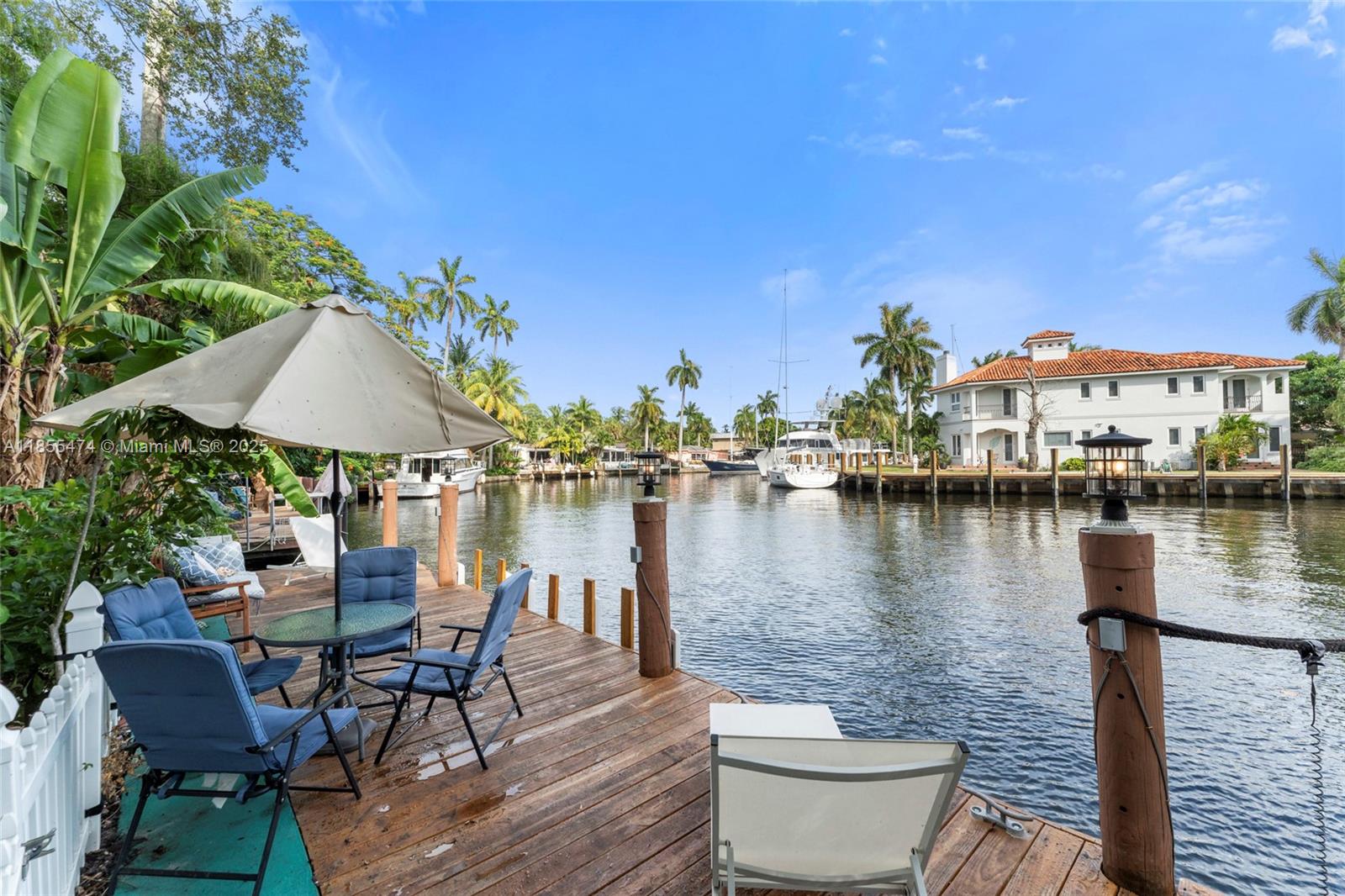 Gated Historic Estate located on the New River! This Waterfront paradise in Sailboat Bend offers Deep-water, Unrestricted Ocean Access with No Fixed Bridges & a 40ft Dock. Stroll to the famous Riverwalk and Las Olas for premier shopping and dining. This exceptional estate showcases common area water views from the spacious family and dining areas, with the kitchen perfectly positioned to frame the serene waterfront backyard. The grand primary suite boasts private river views, spa-inspired bath, cozy sitting area & an expansive canopied balcony. Every room enjoys its own private patio entrance, enhancing the indoor-outdoor lifestyle. Surrounded by lush tropical landscaping, full-width covered porches embody “Old Florida” charm. Additional Features: Furnished & Electric car charger included.