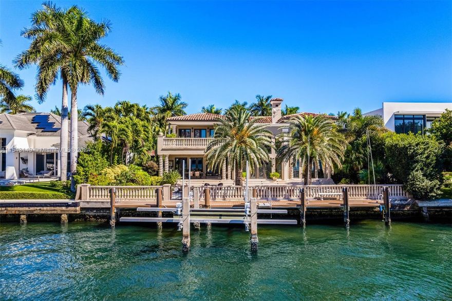 Live in coveted Golden Beach. This exquisite classic residence on the intracoastal waterway fulfills every homeowner's dream. With soaring ceilings and spacious rooms, it offers unparalleled water views. Featuring six bedrooms, new his and hers baths, a gourmet chef's kitchen with top-of-the-line appliances, and a new boat lift and dock, this unique property is truly enviable. The professionally designed landscaping adds to its allure, creating a picturesque and exclusive retreat. Enjoy privacy & security in a serene coastal utopia, with its own police force and marine patrol. Live just minutes from world-class shopping, dining, a private beachfront clubhouse and tennis courts. Endless sunrises & white sand beaches await you.