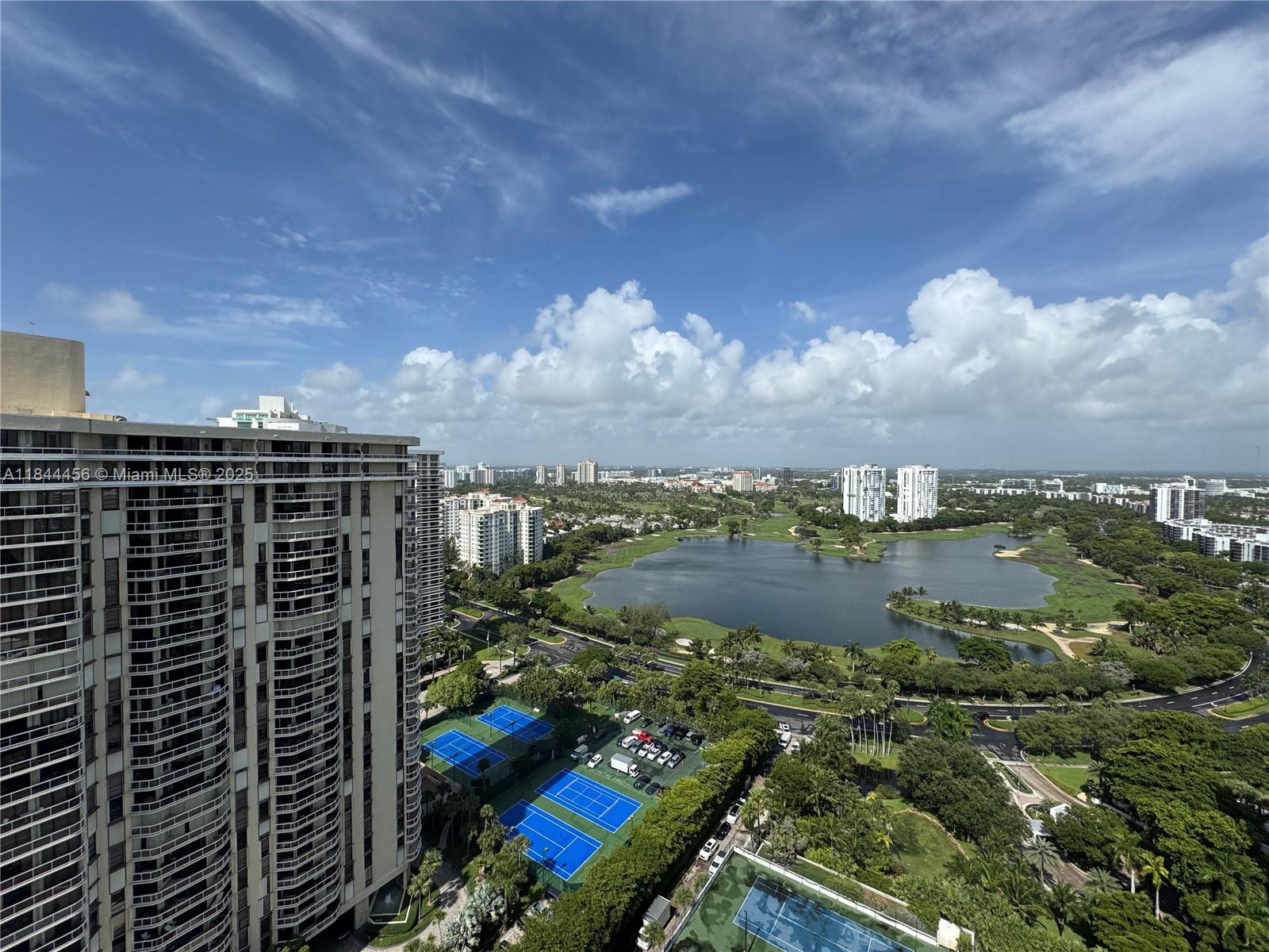 Luxury penthouse living in Aventura’s prestigious Hamptons South! This 6-bed, 7.5-bath residence boasts floor-to-ceiling windows, marble floors, and a private rooftop terrace with panoramic views of the Atlantic Ocean, Intracoastal, and golf course. Enjoy a gourmet kitchen with top-tier appliances, custom cabinetry, built-in cooler, butler’s pantry with a second fridge, and reverse osmosis water filtration. The primary suite features spa-style baths and custom closets. Smart RBI lighting and sound throughout. Resort-style amenities include a clubhouse, restaurant, karaoke lounge, theater, tennis, basketball, spa, pools, fitness centers, business center, playroom, park, and valet. Just minutes from Aventura Mall, fine dining, beaches, and top-rated schools.