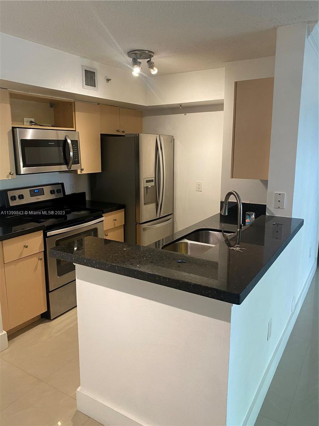 Photo of 2433 Centergate Dr #107, Miramar, FL 33025 (MLS # A11399843)